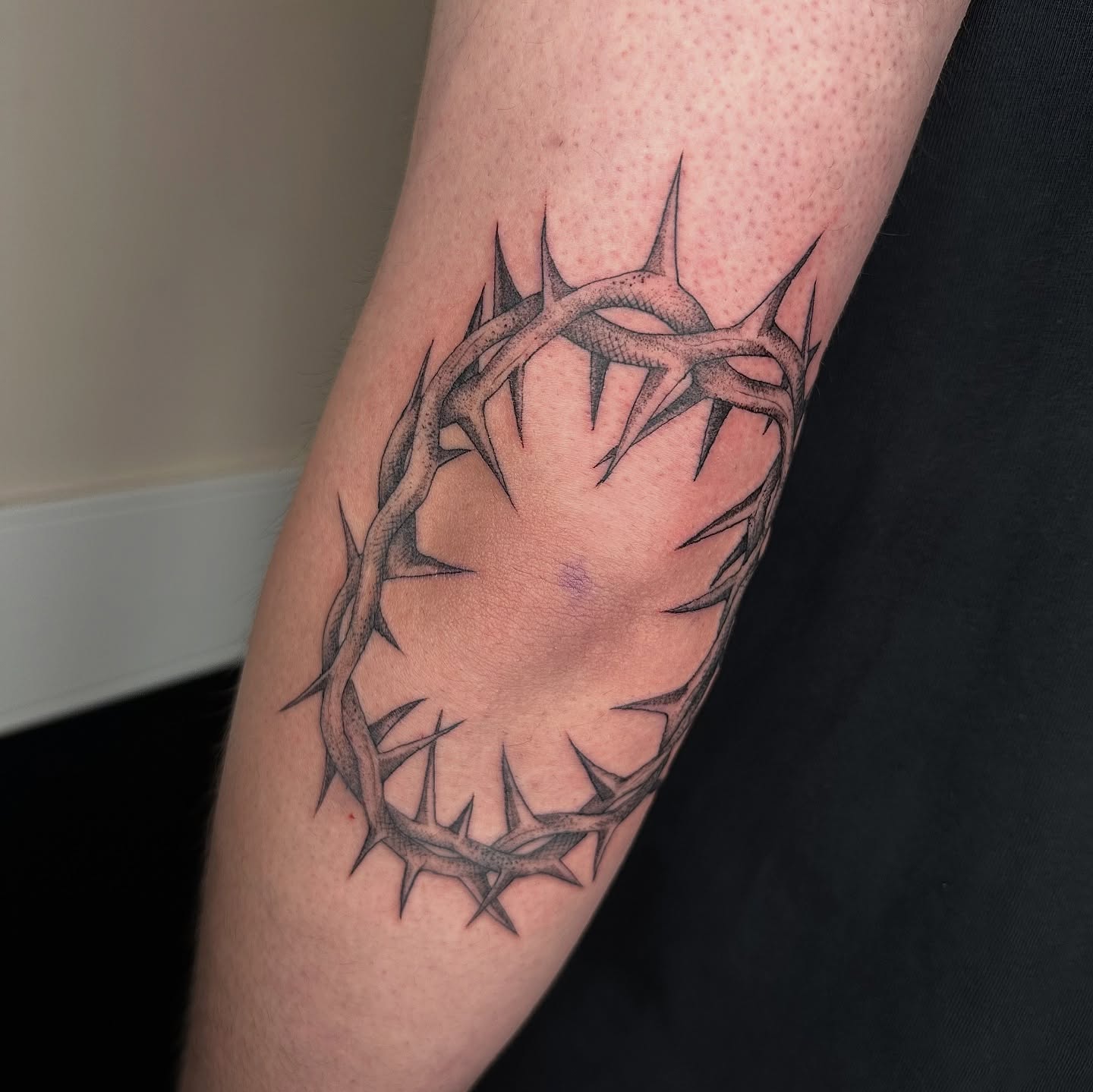 Crown of thorns black and grey tattoo on the forearm by sechi