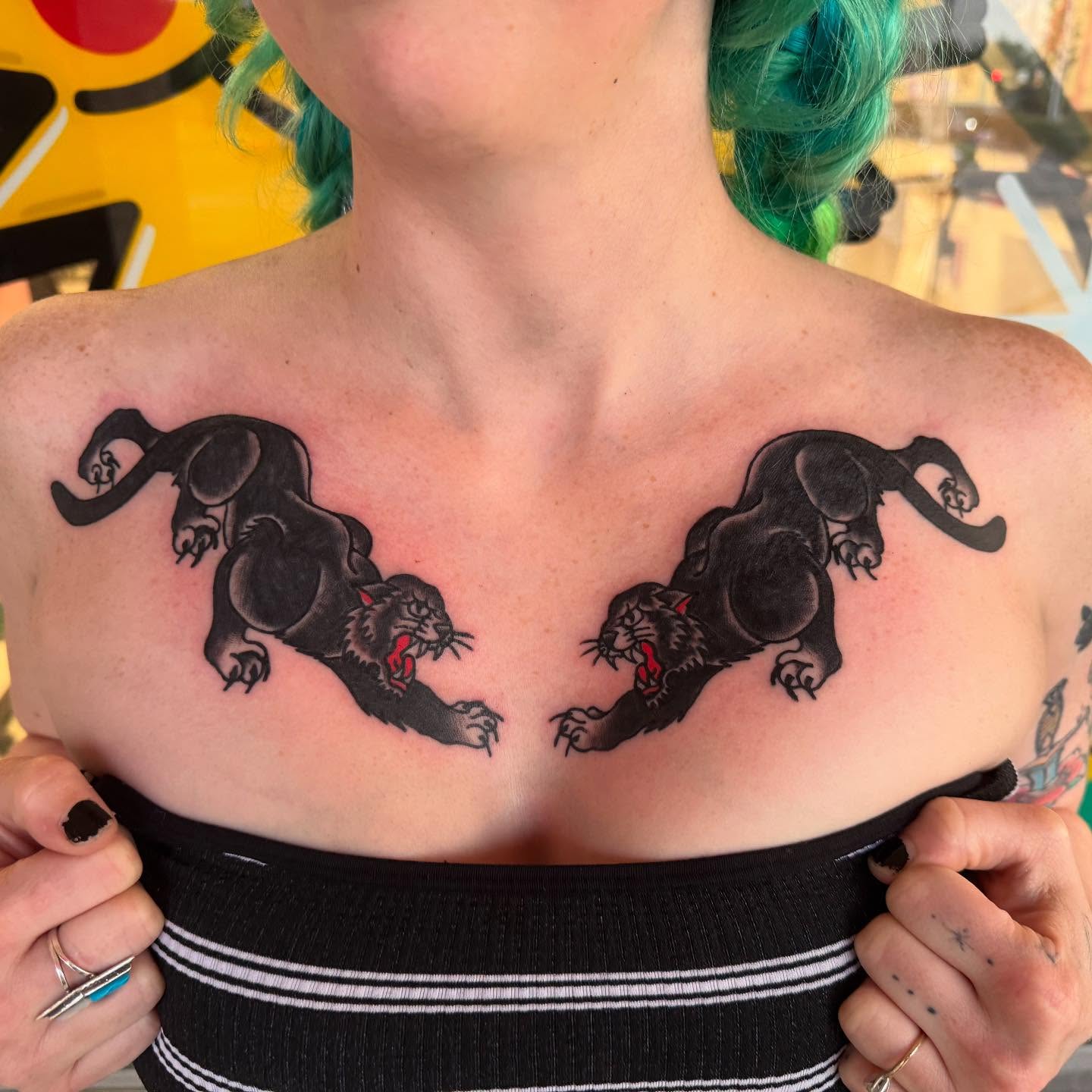 Panthers American traditional tattoo on the chest by Atom Aker