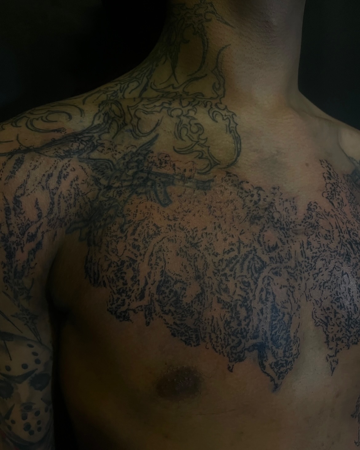 Abstract design black and grey tattoo on the chest by ɴᴏᴍᴢ ᴅʏsᴇᴍʙᴏᴅɪᴍᴇɴᴛ