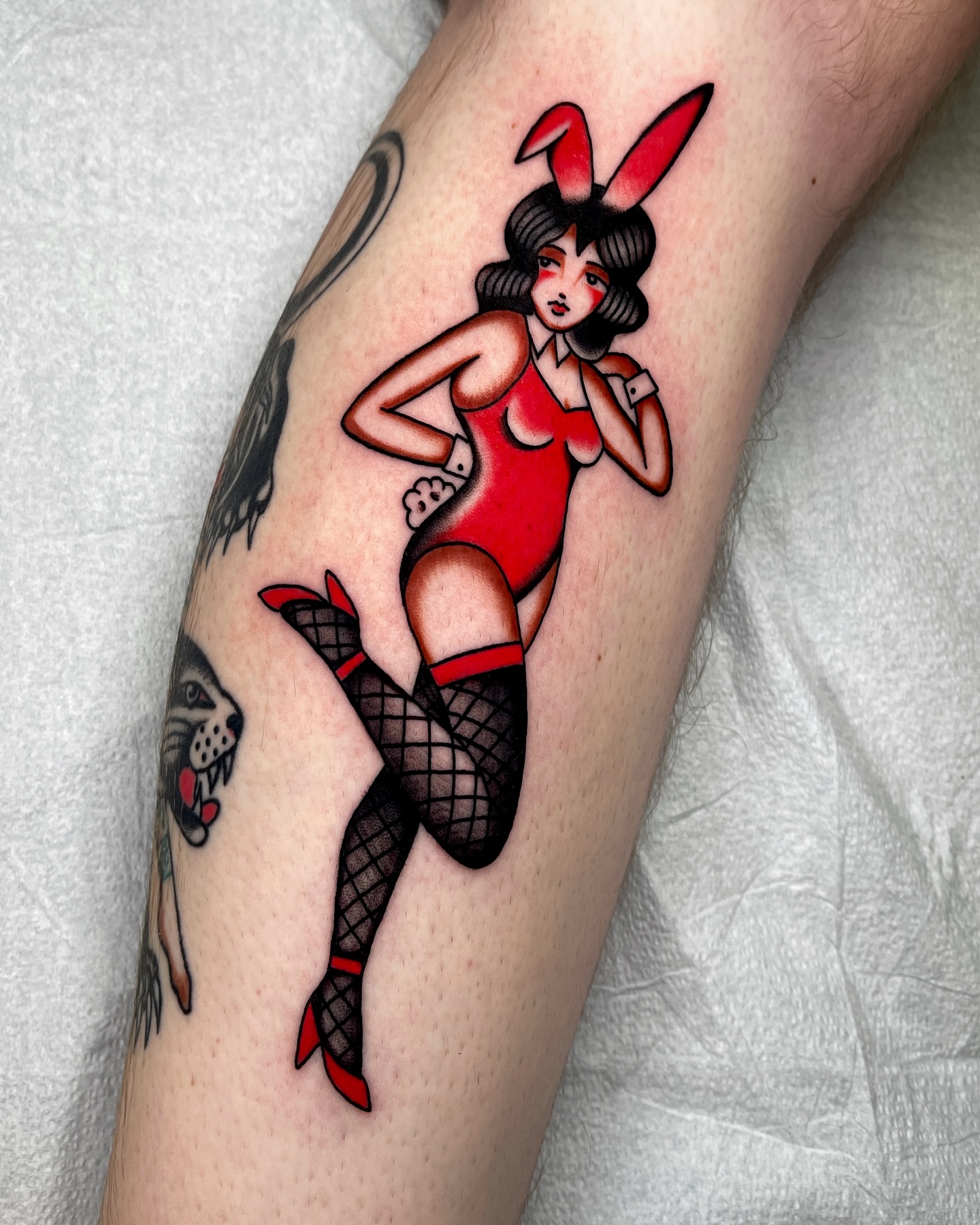 Bunny girl American traditional tattoo on the forearm by Chase Tucker