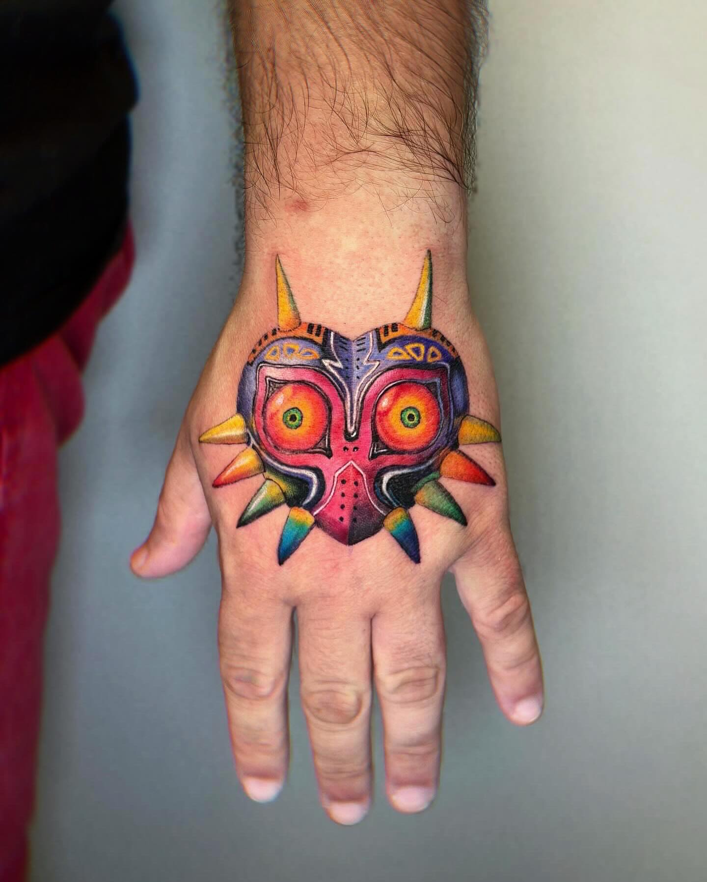 Majora's Mask geometric tattoo on the hand by Yu Chen