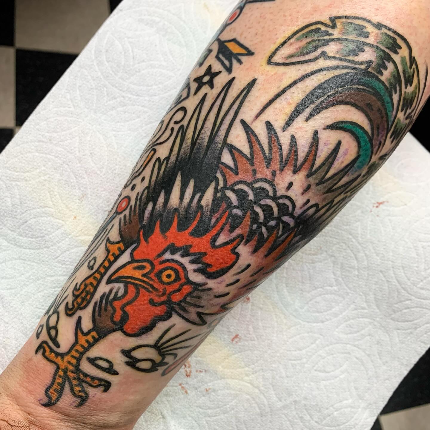 Rooster American traditional tattoo on the forearm by Los Angeles Tattoo Artist