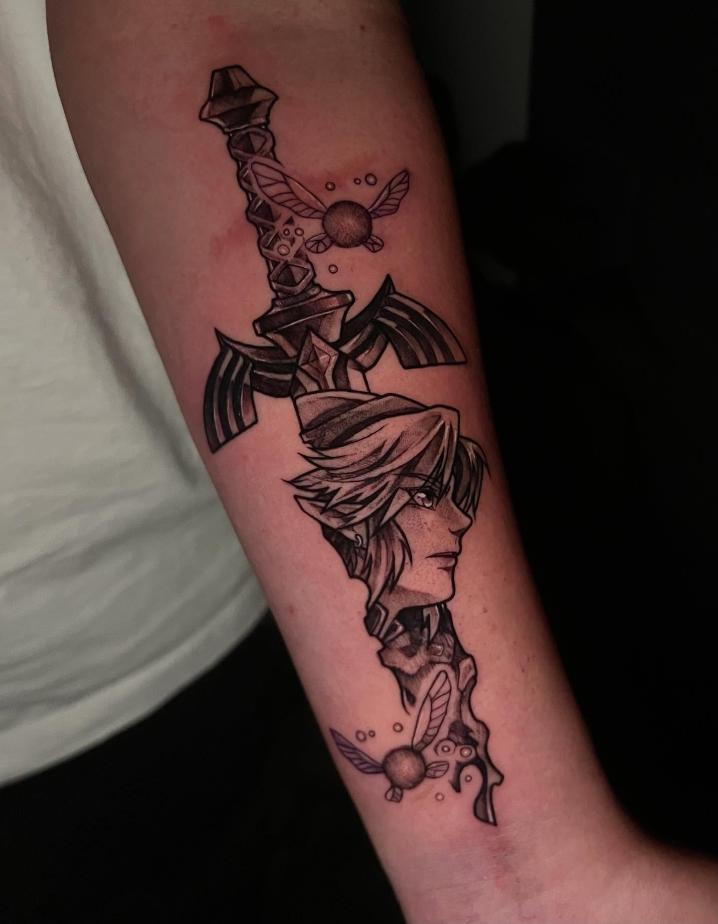 Sword and character realism tattoo on the forearm by emi