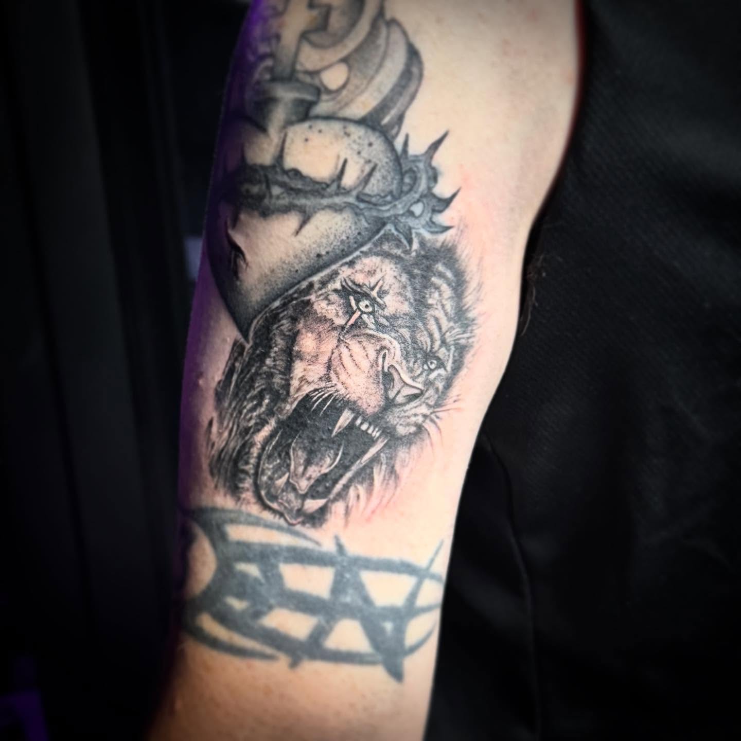 Lion with crown realism tattoo on the forearm by AaronAdlerTattoos.com, Cincinnati