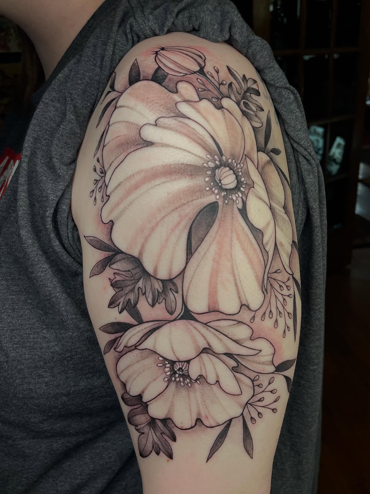 Floral arrangement black and grey tattoo on the shoulder by Lauren Sisouphanh, Canton, Ohio