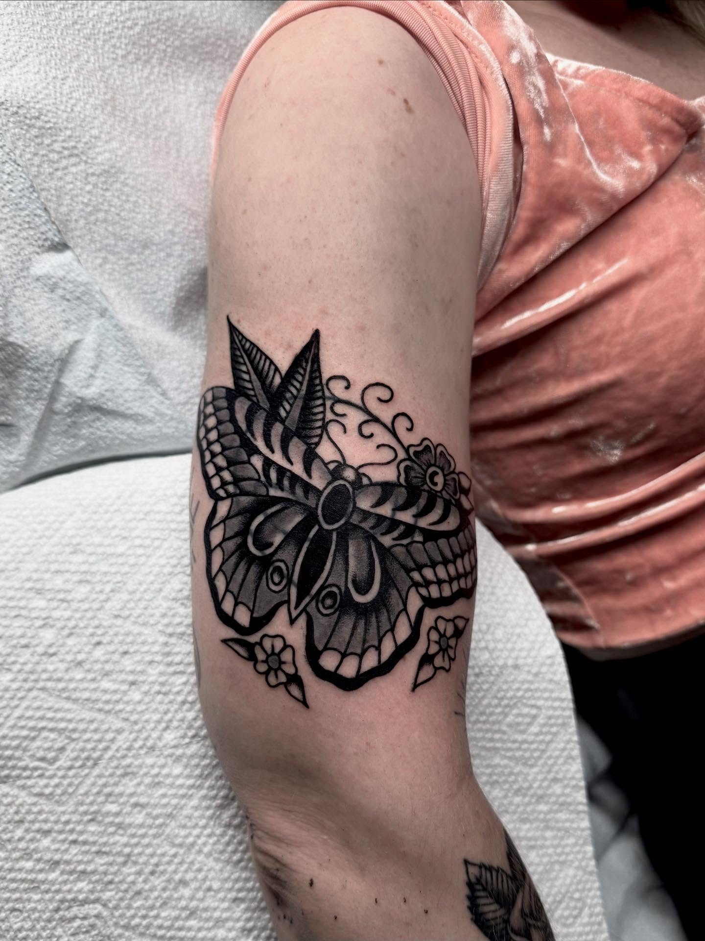 Butterfly black and grey tattoo on the forearm by Cody Petkus