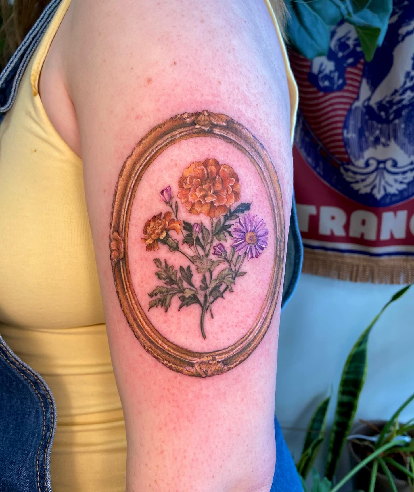 Flower bouquet realism tattoo on the forearm by Amber Miracle