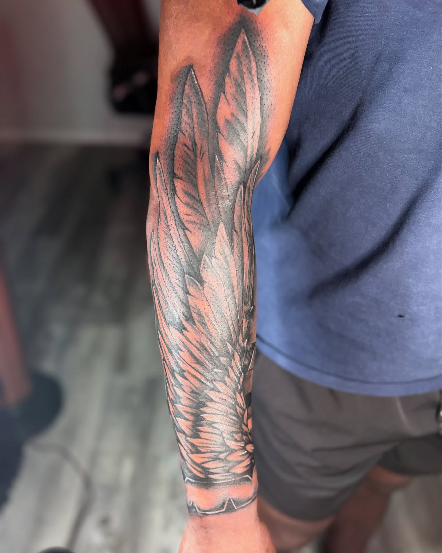 Feather dotwork tattoo on the forearm by Maleek Inkz