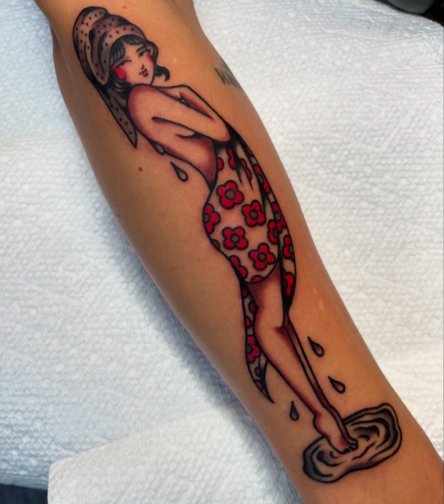 Woman washing dishes American traditional tattoo on the forearm by kate
