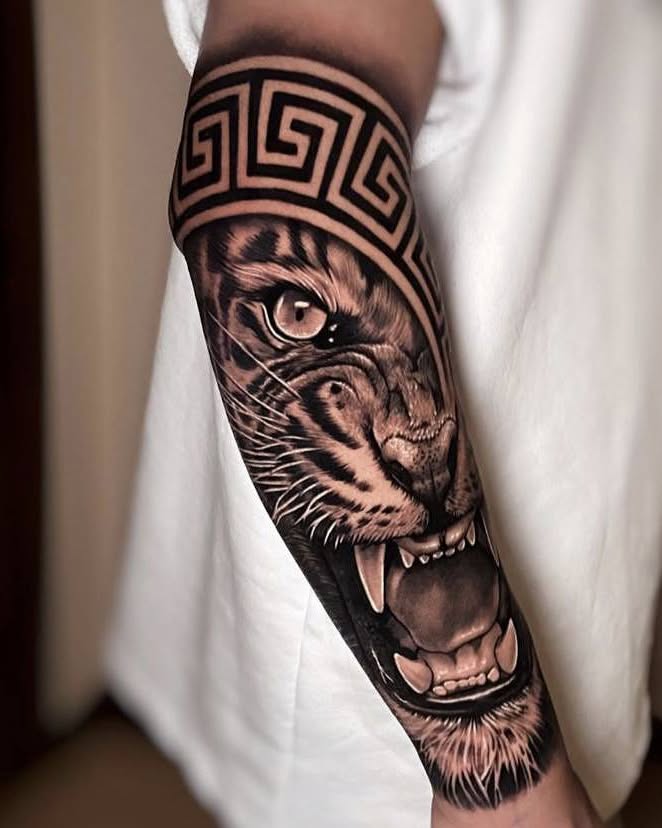 Tiger realism tattoo on the forearm by Peter John