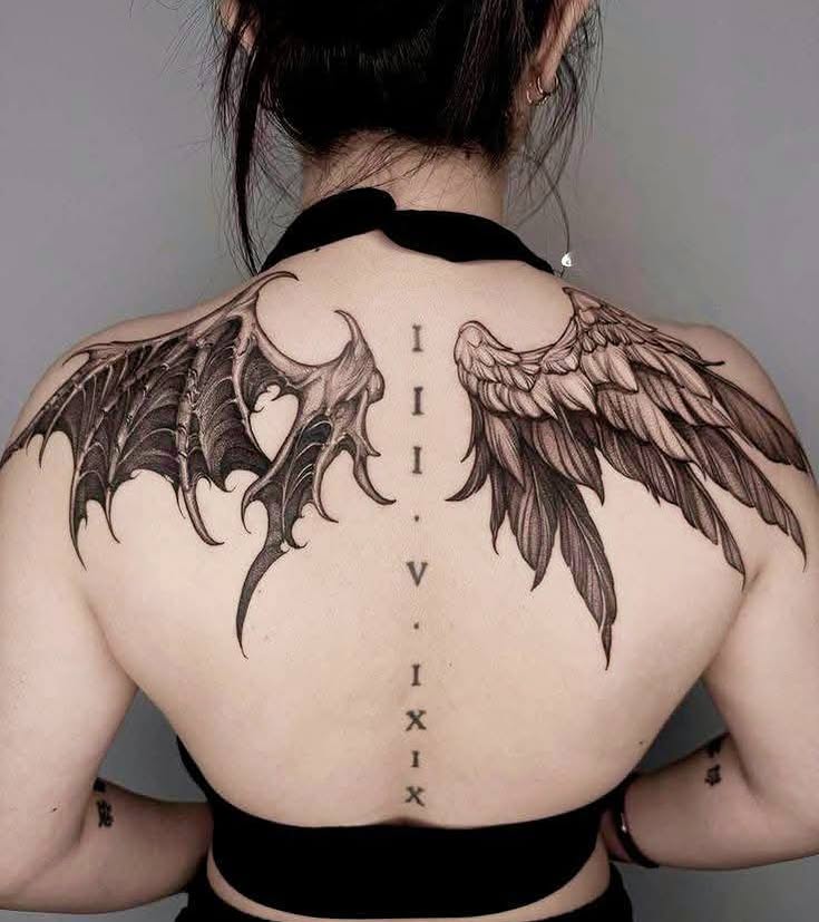 Wings black and grey tattoo on the back by Peter John