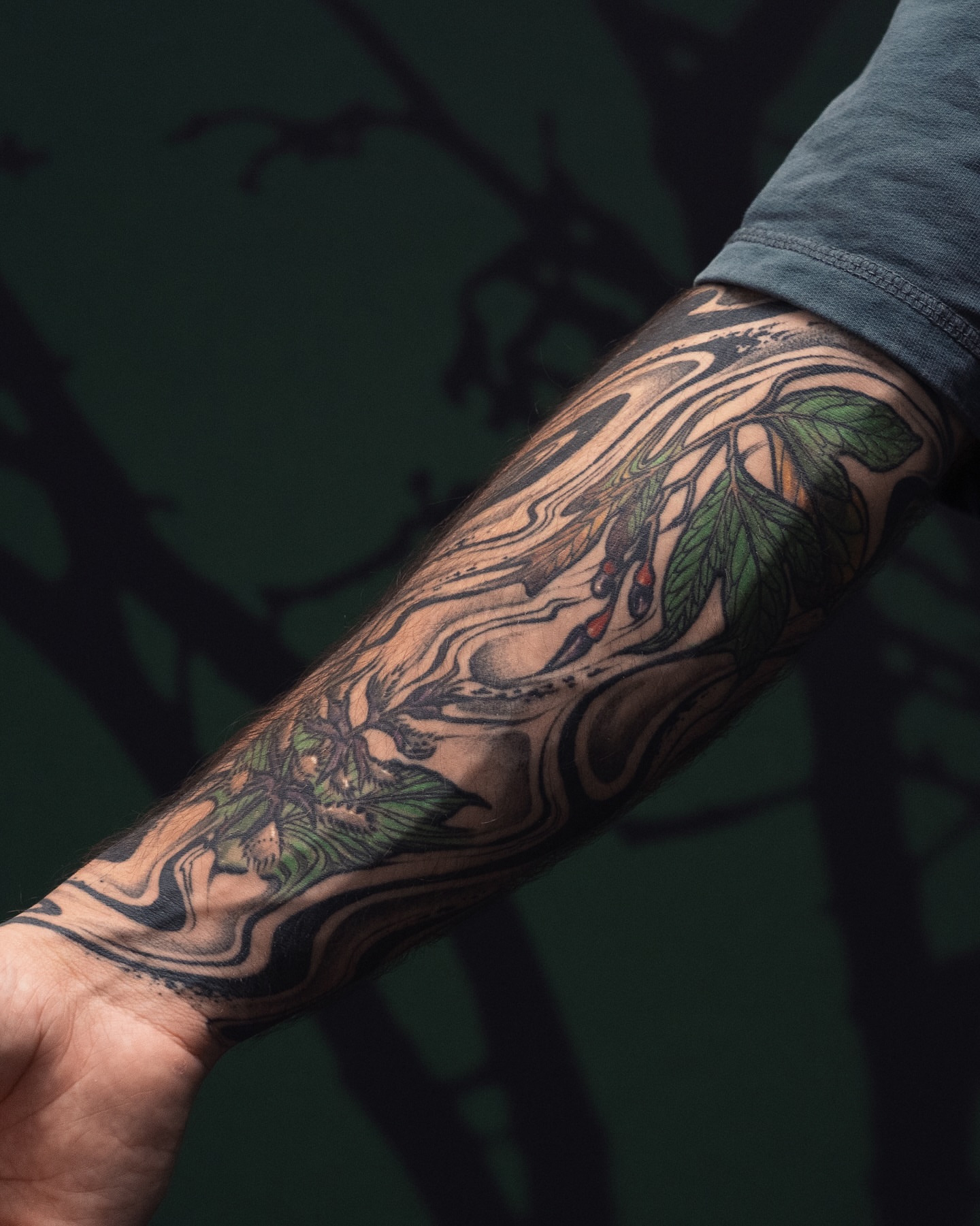 Tree branch with leaves realism tattoo on the forearm by Katie Mizuno, Berkeley, California