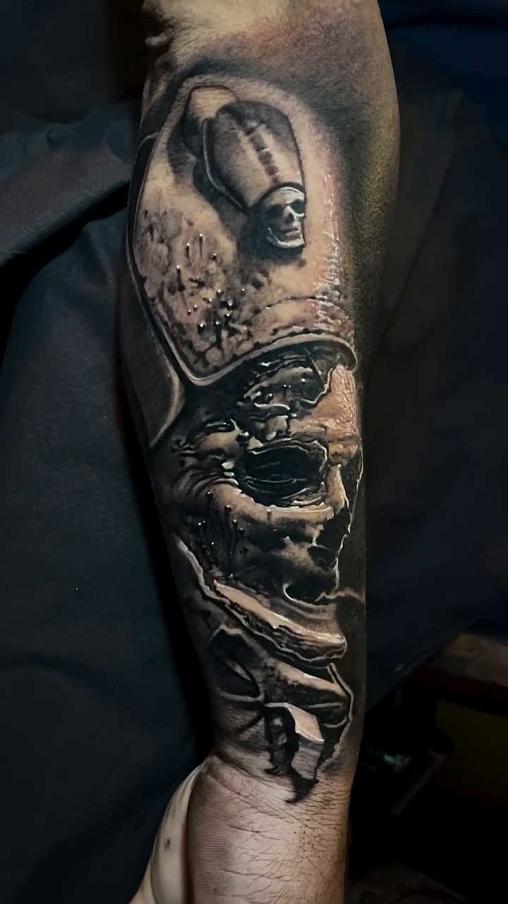 Skull with crown and religious iconography realism tattoo by Robert Hernandez