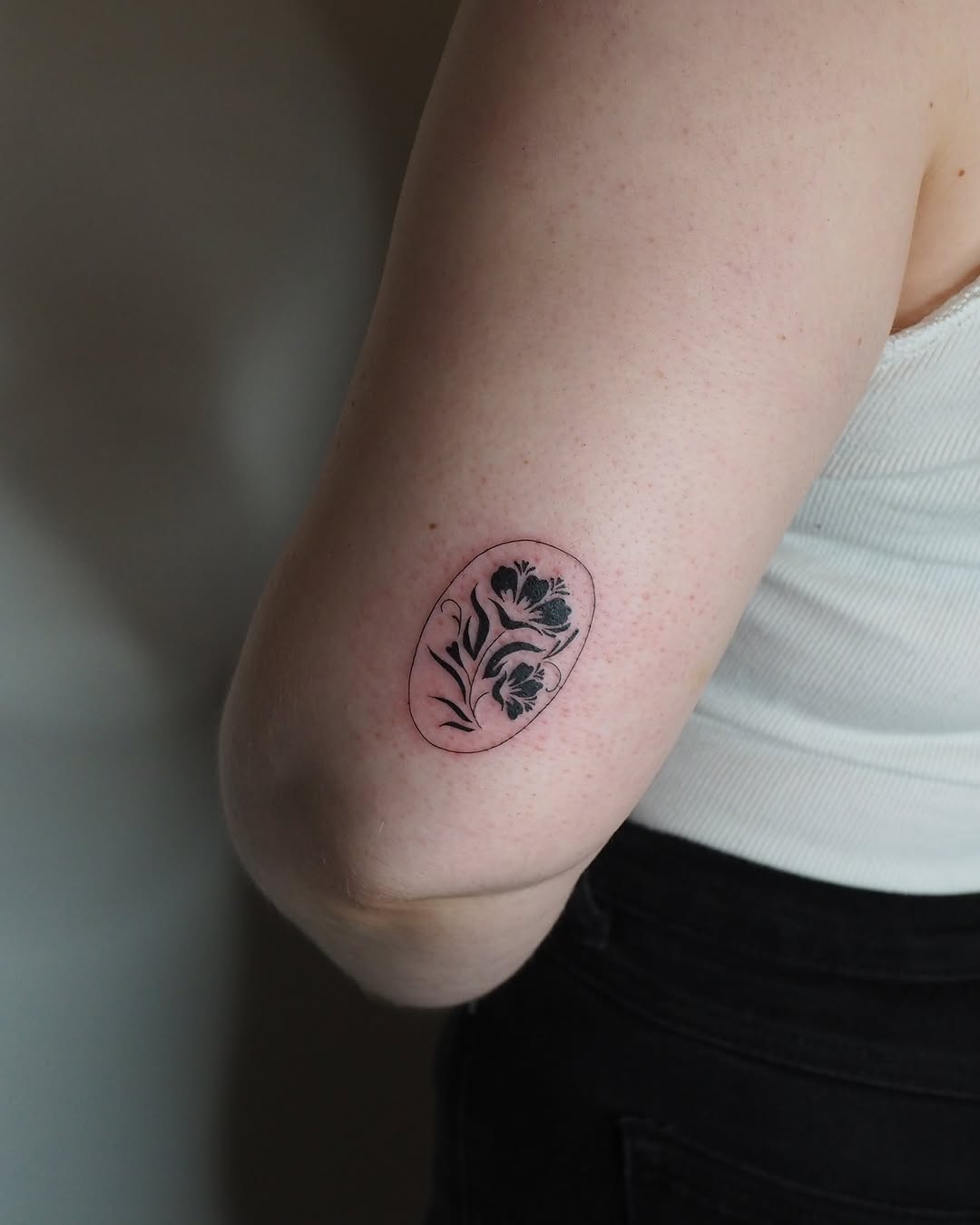 Floral design minimalist tattoo on the forearm by A. Eye Tat