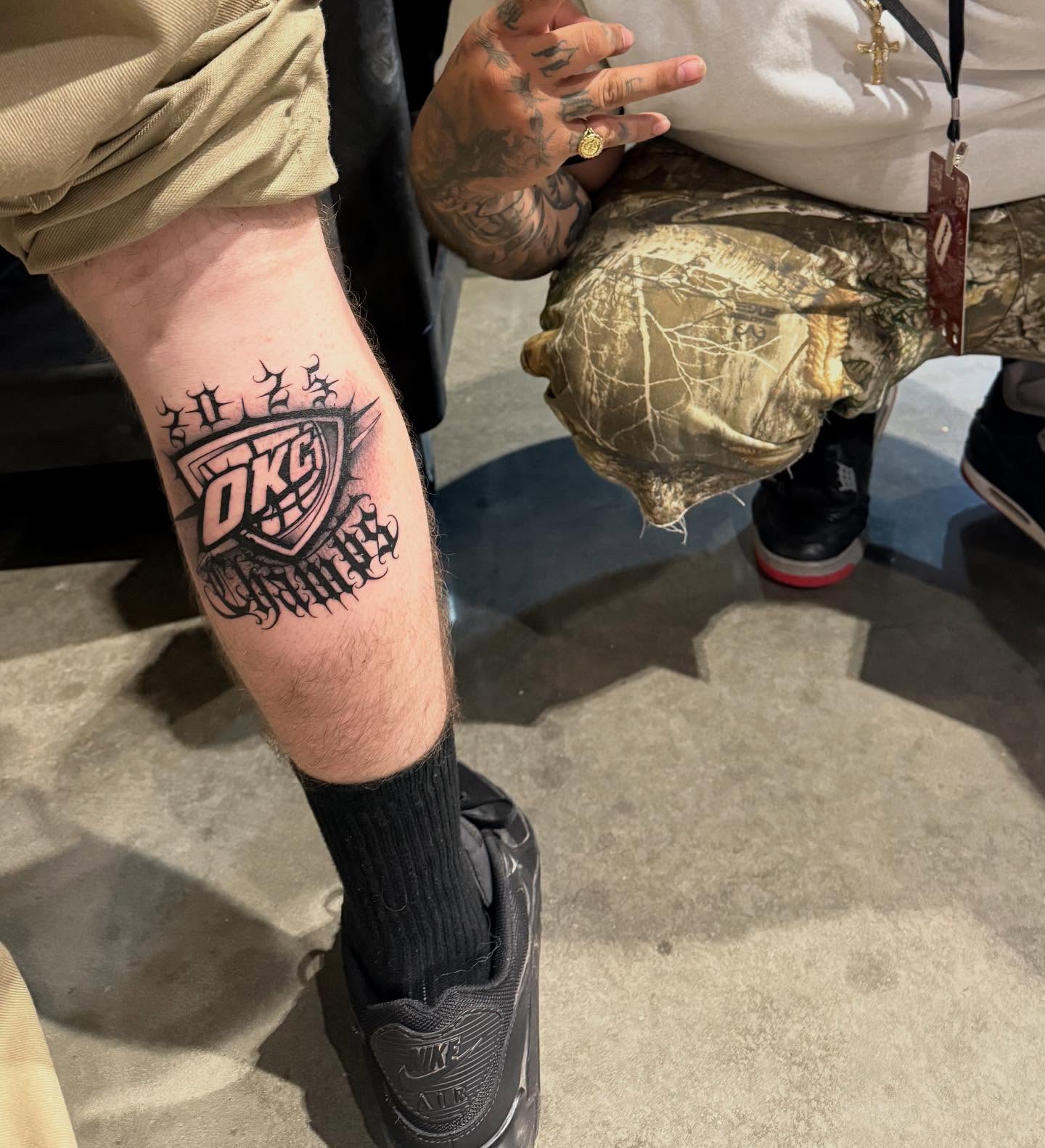 Okc thunder logo black and grey tattoo on the forearm by Smuk One