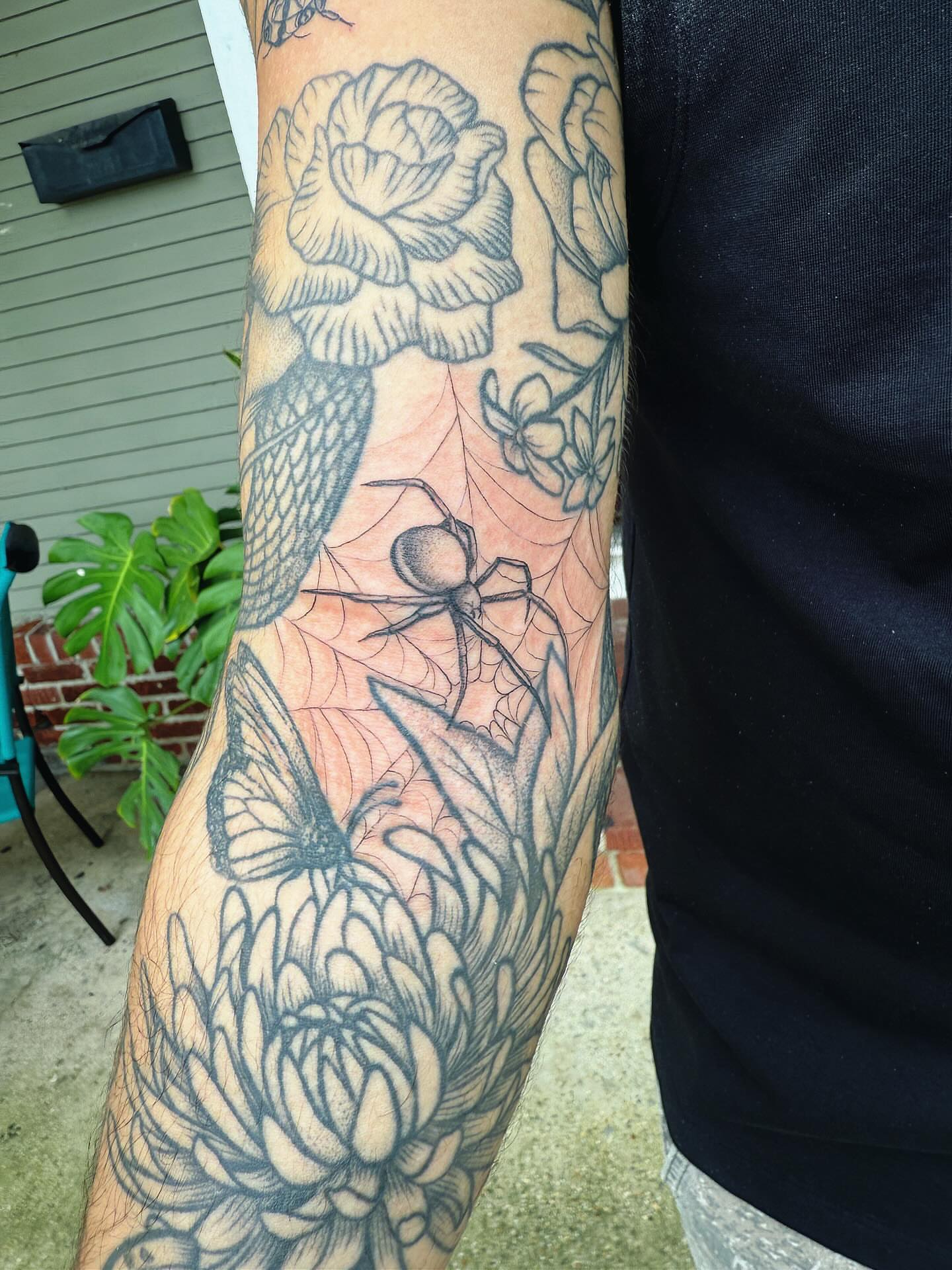 Floral and spider realism tattoo on the forearm by π½πππππ π½πππππππ, New Orleans, Louisiana