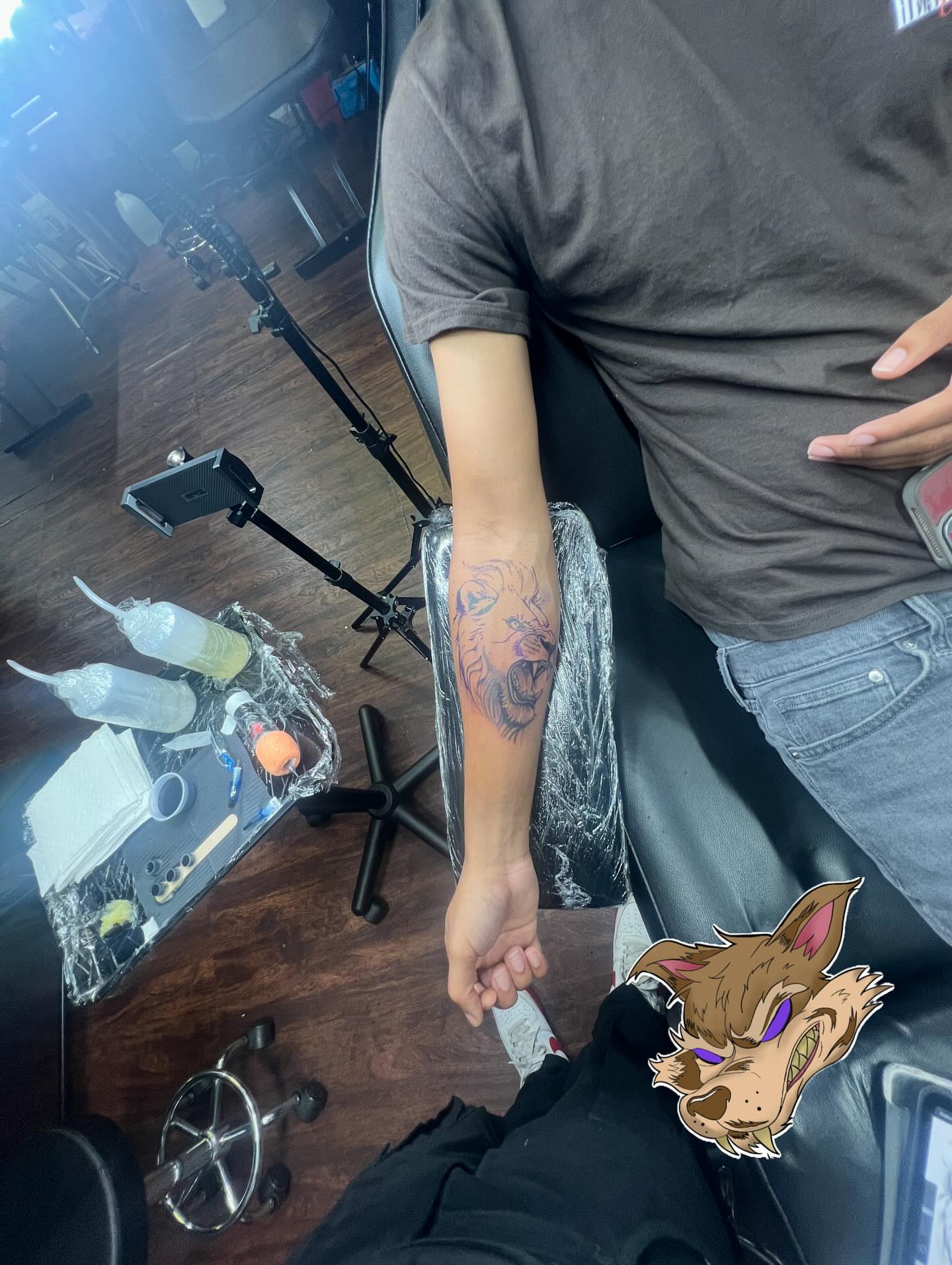 Lion head realism tattoo on the forearm by Glass Inkk