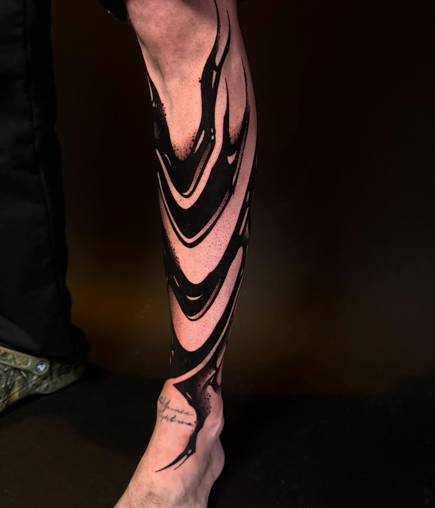 Abstract flame dotwork tattoo on the forearm by Dylan Orbock, Berkeley, California