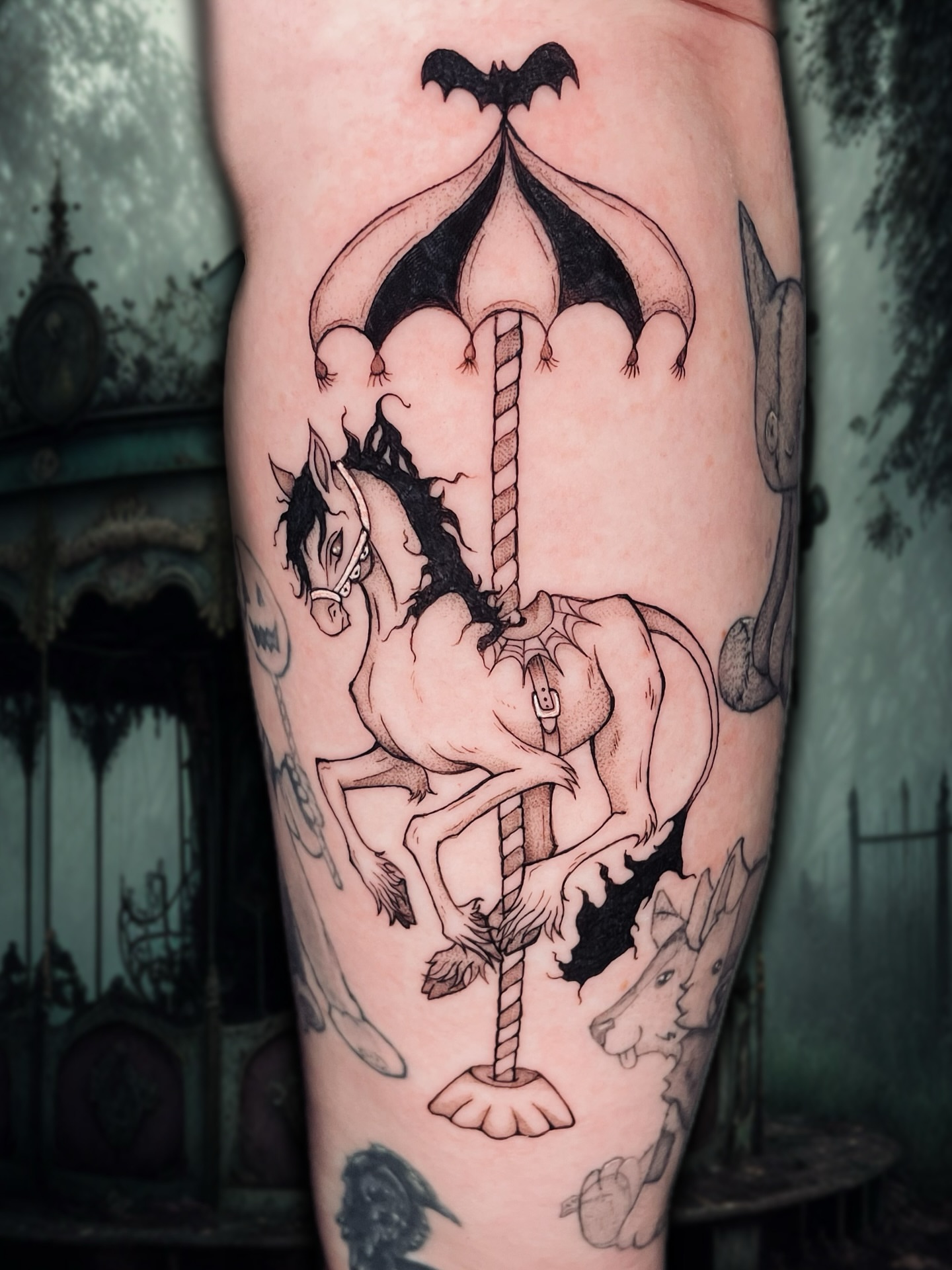 Carousel horse black and grey tattoo on the forearm by Shontel Fowler