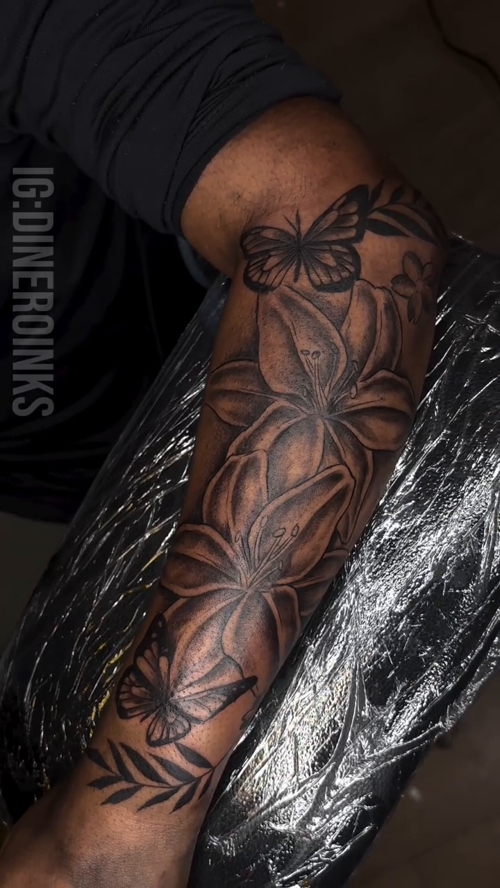 Flowers and butterflies realism tattoo by Dinero Inks