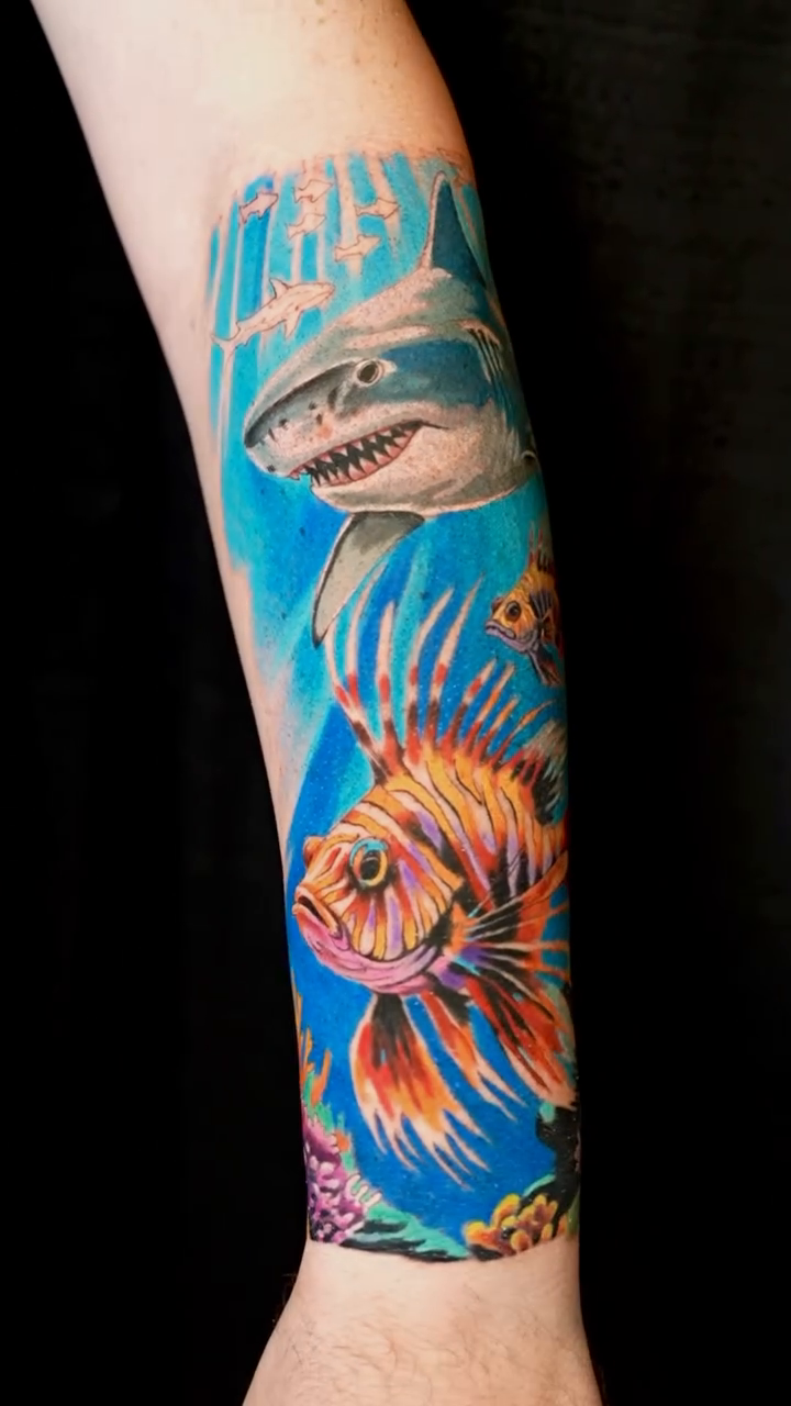 Underwater scene with shark and lionfish realism tattoo by Dharma.tattoo