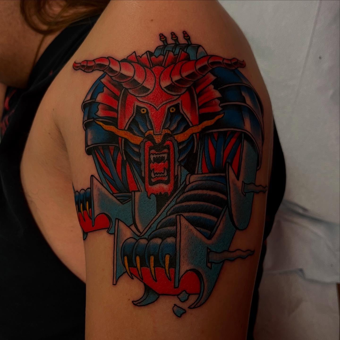 Mecha American traditional tattoo on the shoulder by Lee Brewster, Erlanger, Kentucky