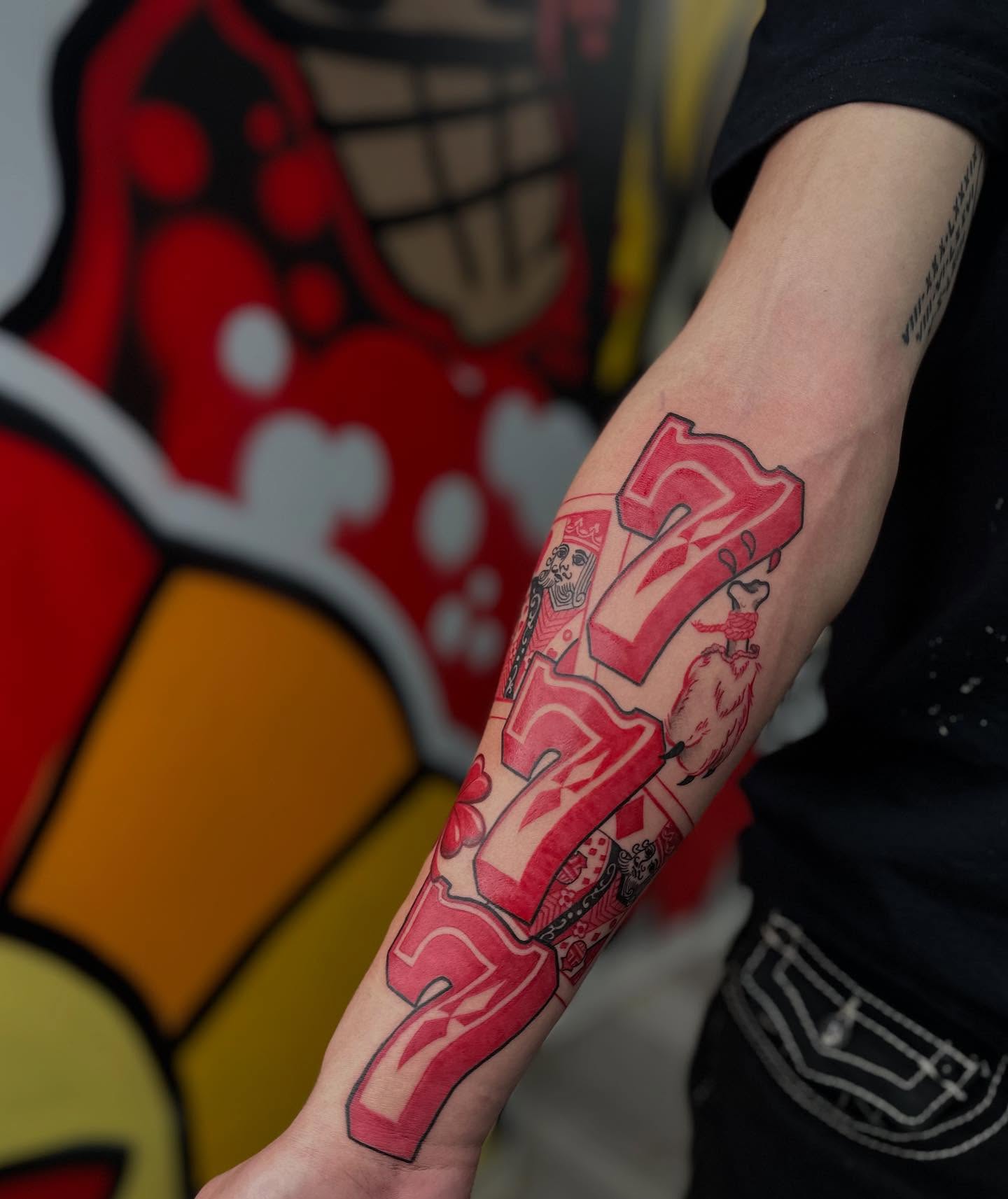 Number 777 lettering script tattoo on the forearm by Antonio