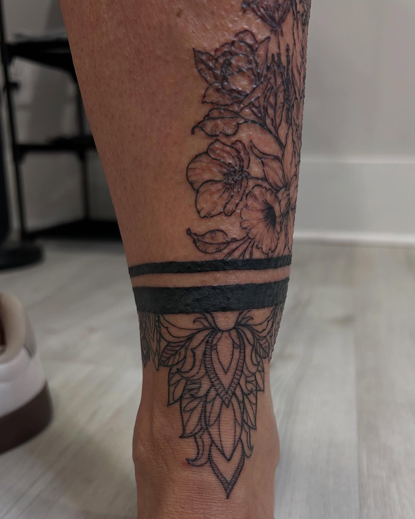 Floral design black and grey tattoo on the calf by Jbtattoo Artistry