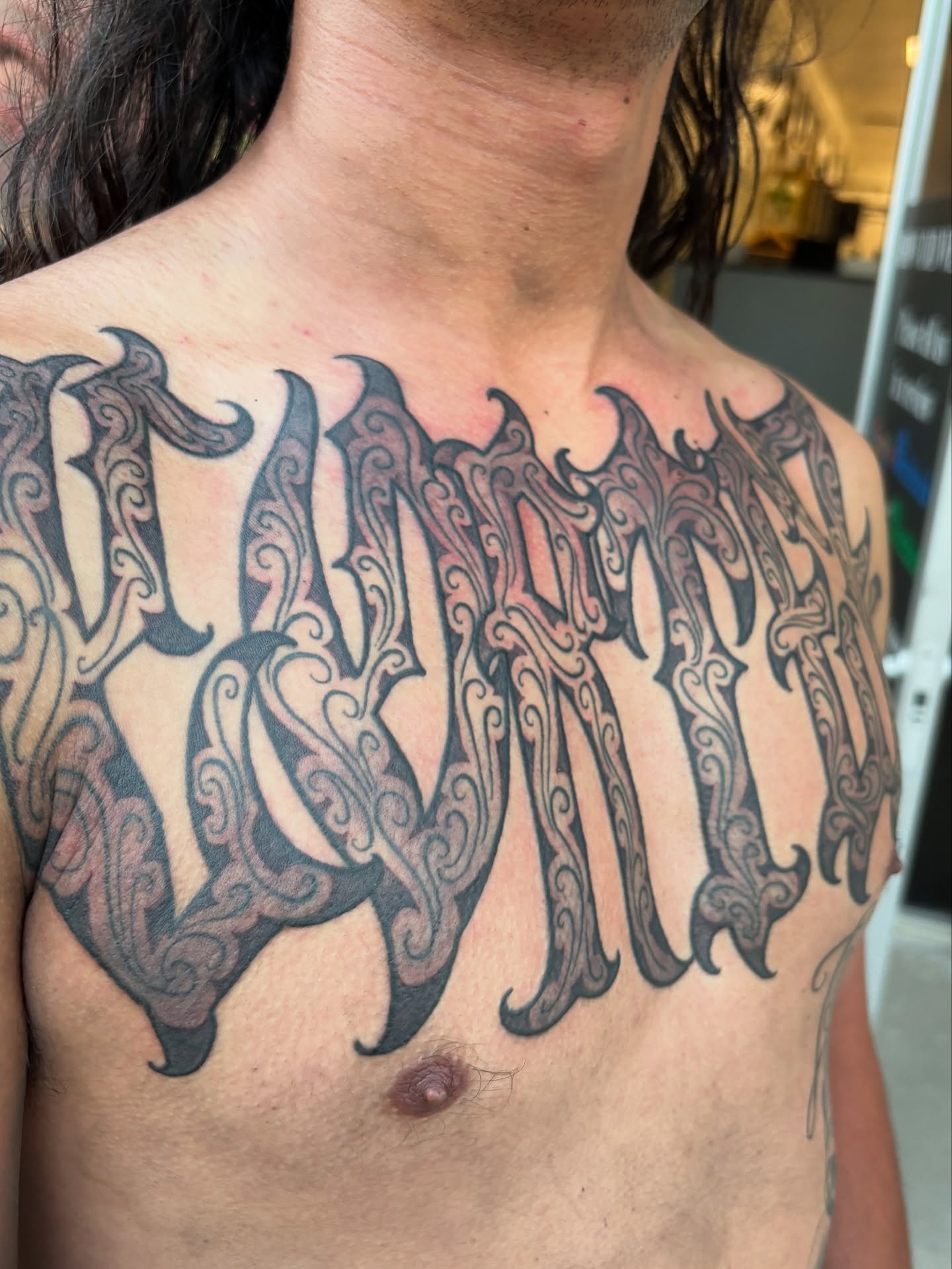 Script lettering lettering script tattoo on the chest by Cristiano Ochoa, Elk Grove, California