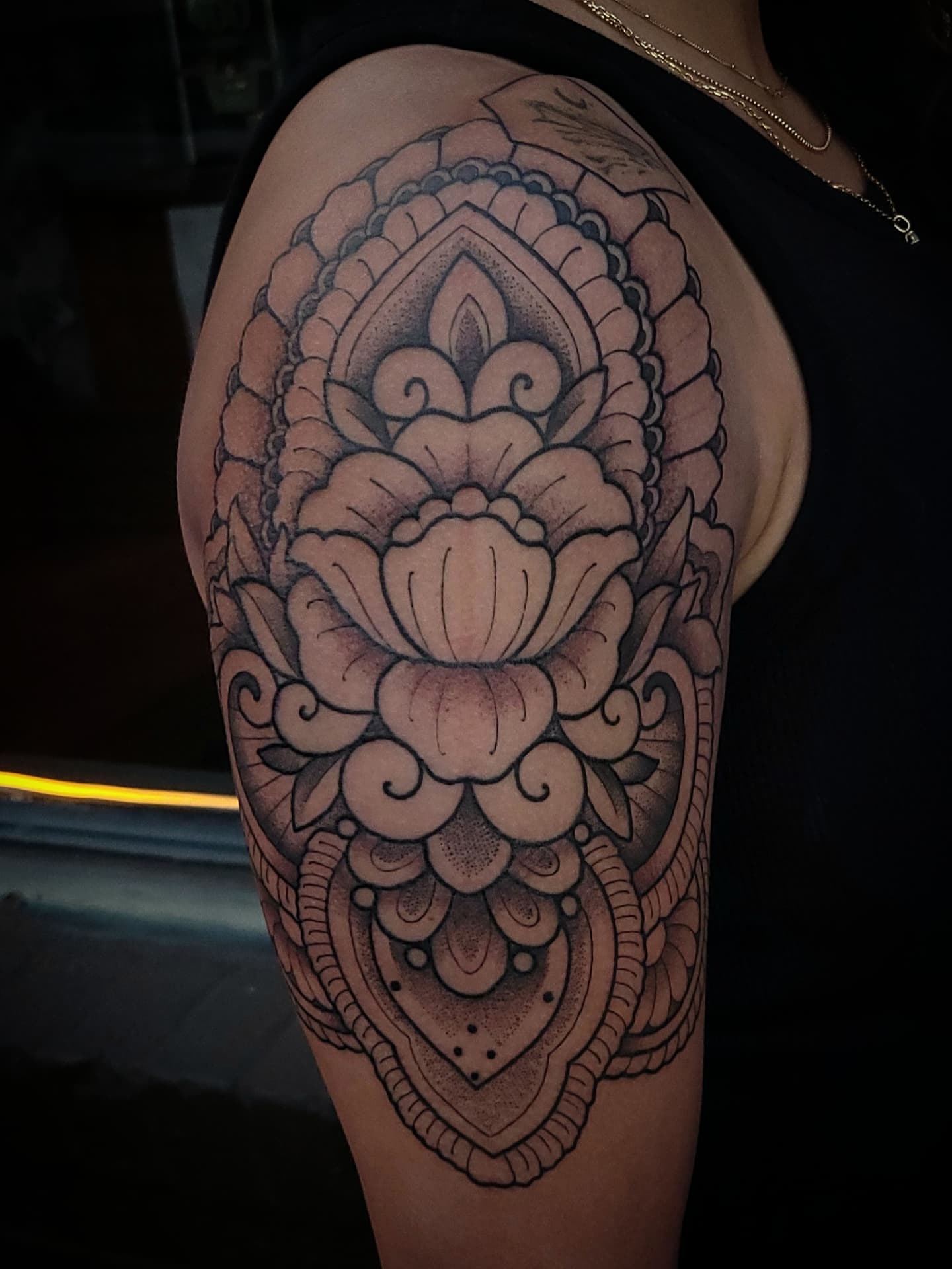 Lotus flower ornamental tattoo on the shoulder by Sean Hollinger