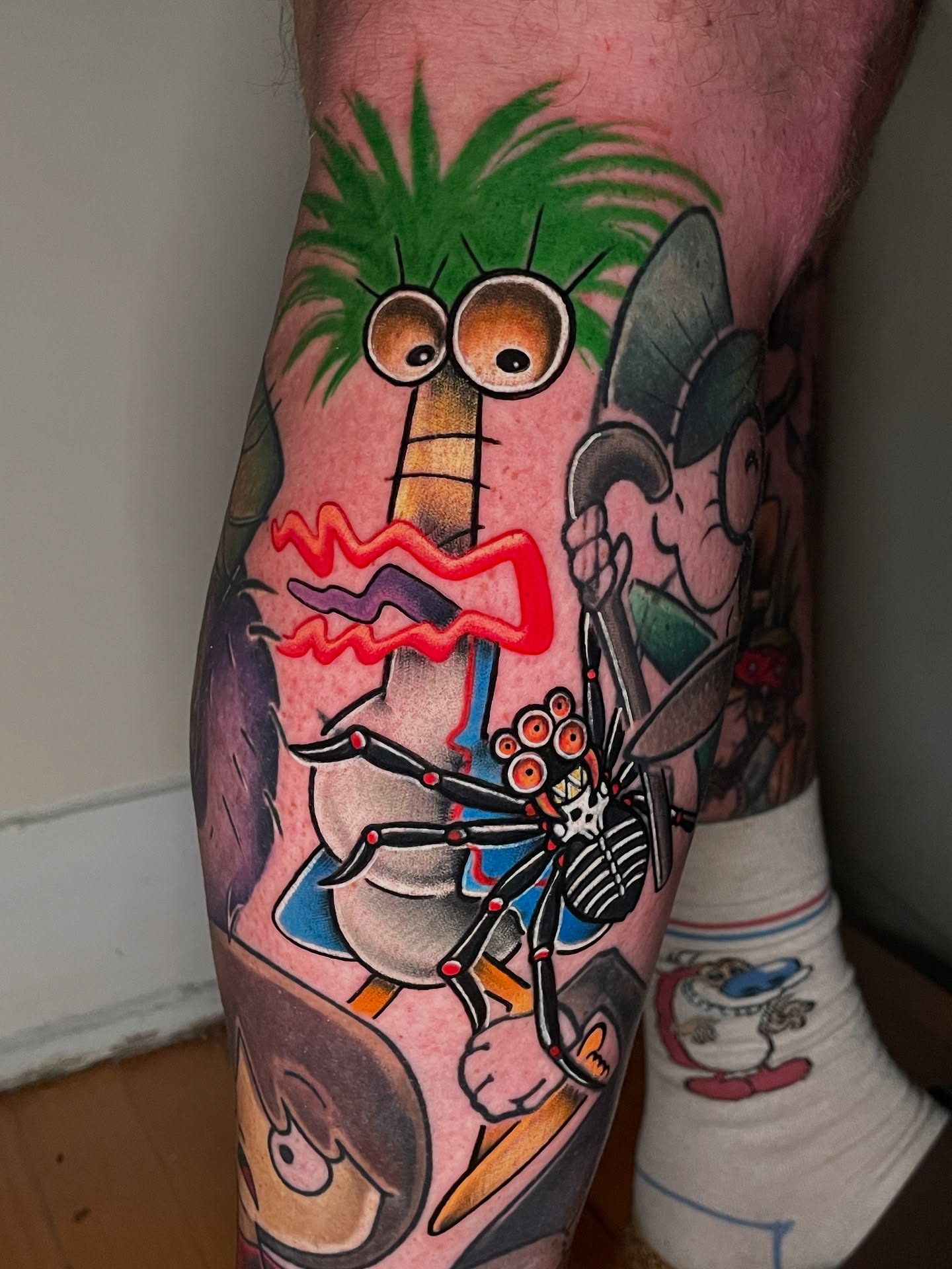 Cartoon character new school tattoo on the leg by Kimberly Parton- Chapel Hill Tattooer, Chapel Hill, North Carolina