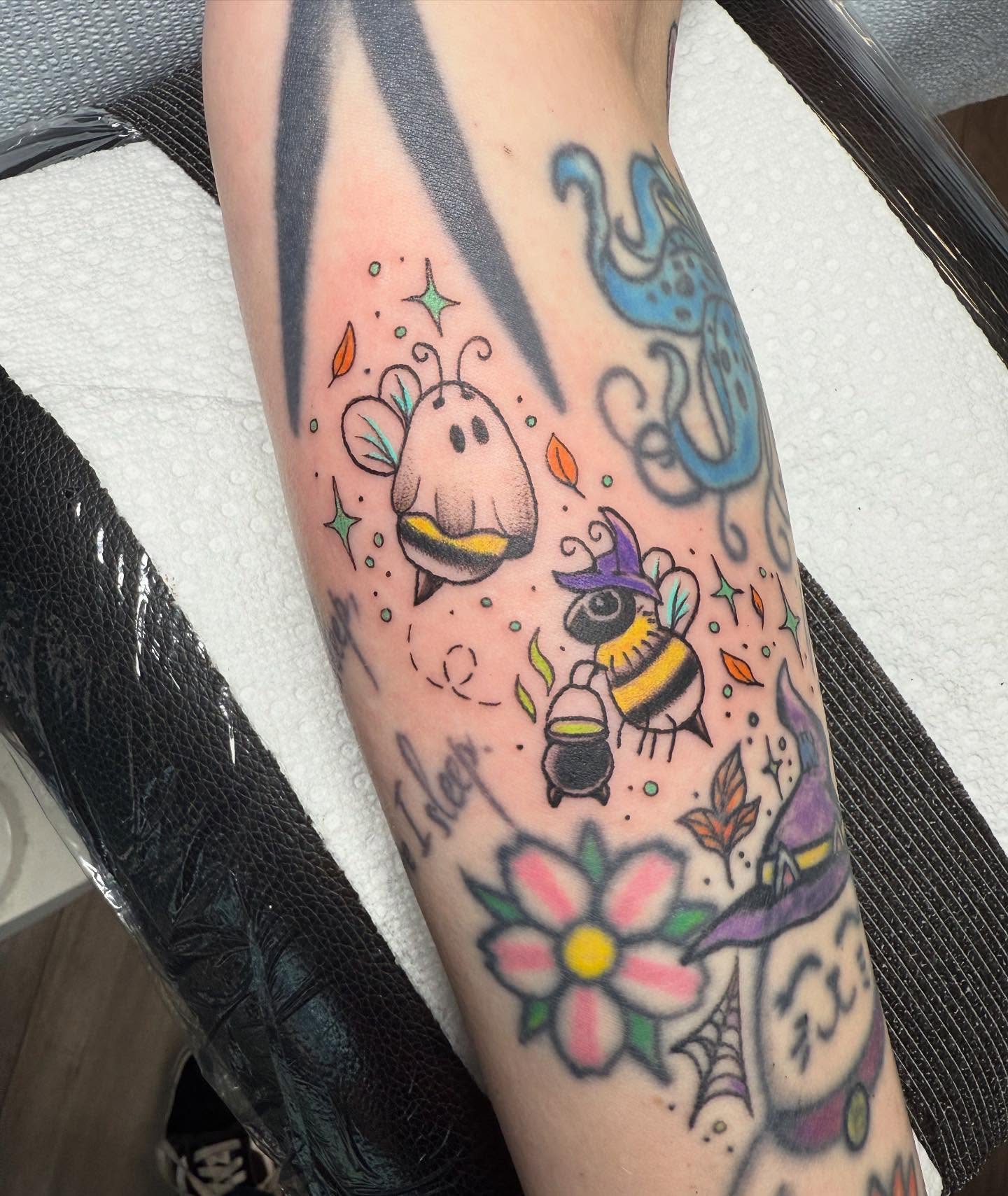 Bees and flowers new school tattoo on the forearm by Michelle