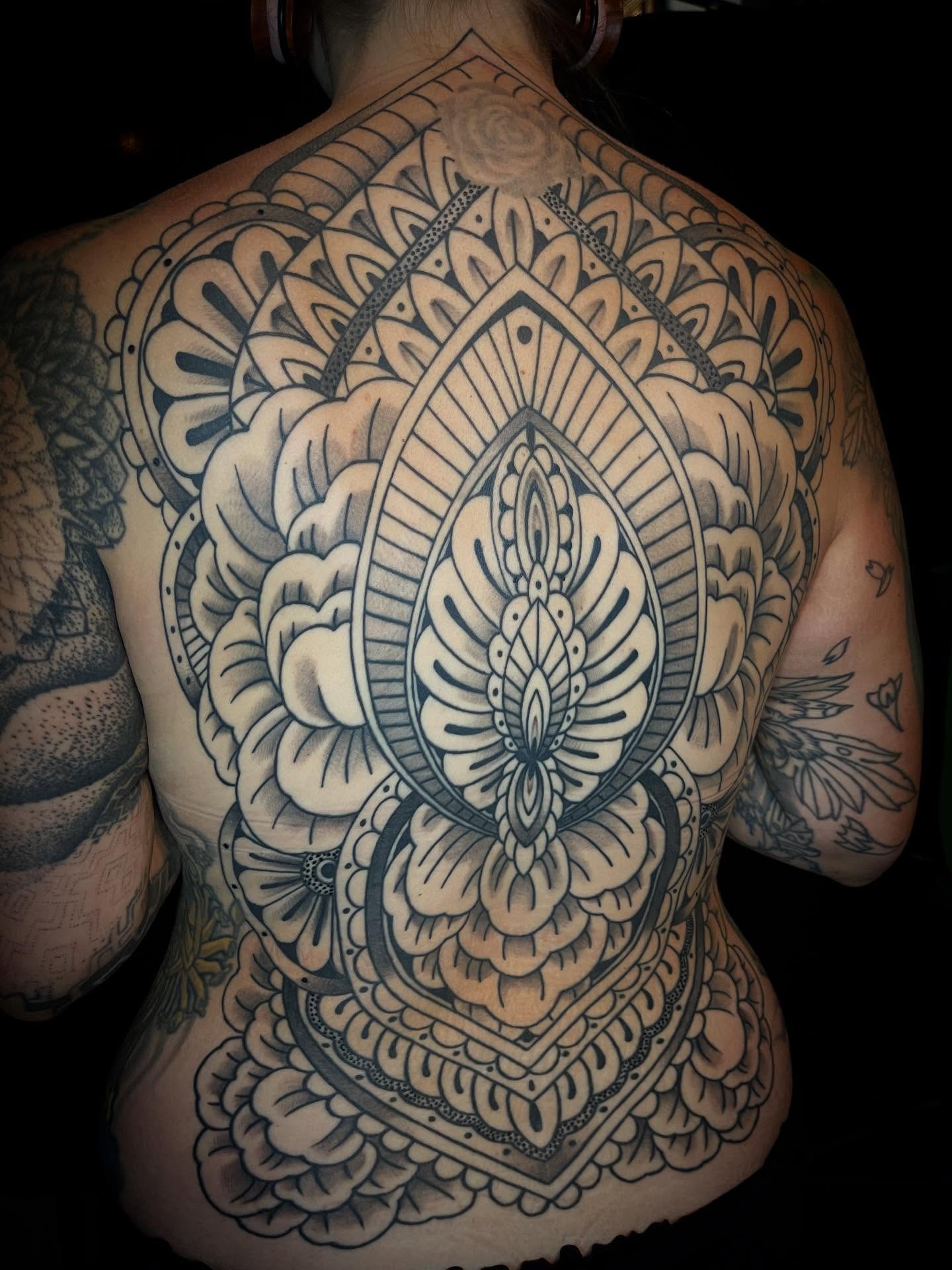 Mandala ornamental tattoo on the back by Jacob Finelli