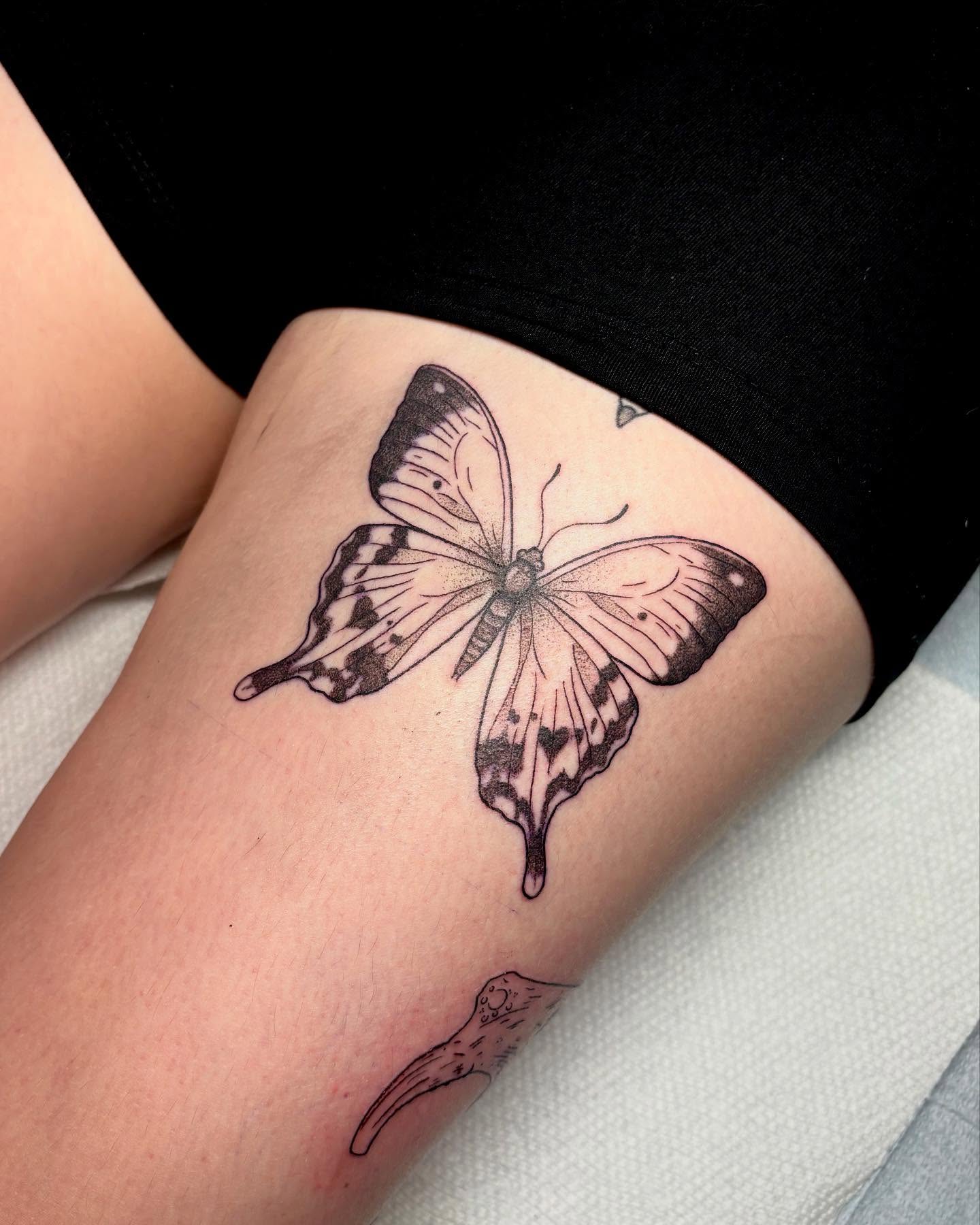 Butterfly black and grey tattoo on the thigh by ⓣⓞⓡⓘ, Bangor, Maine