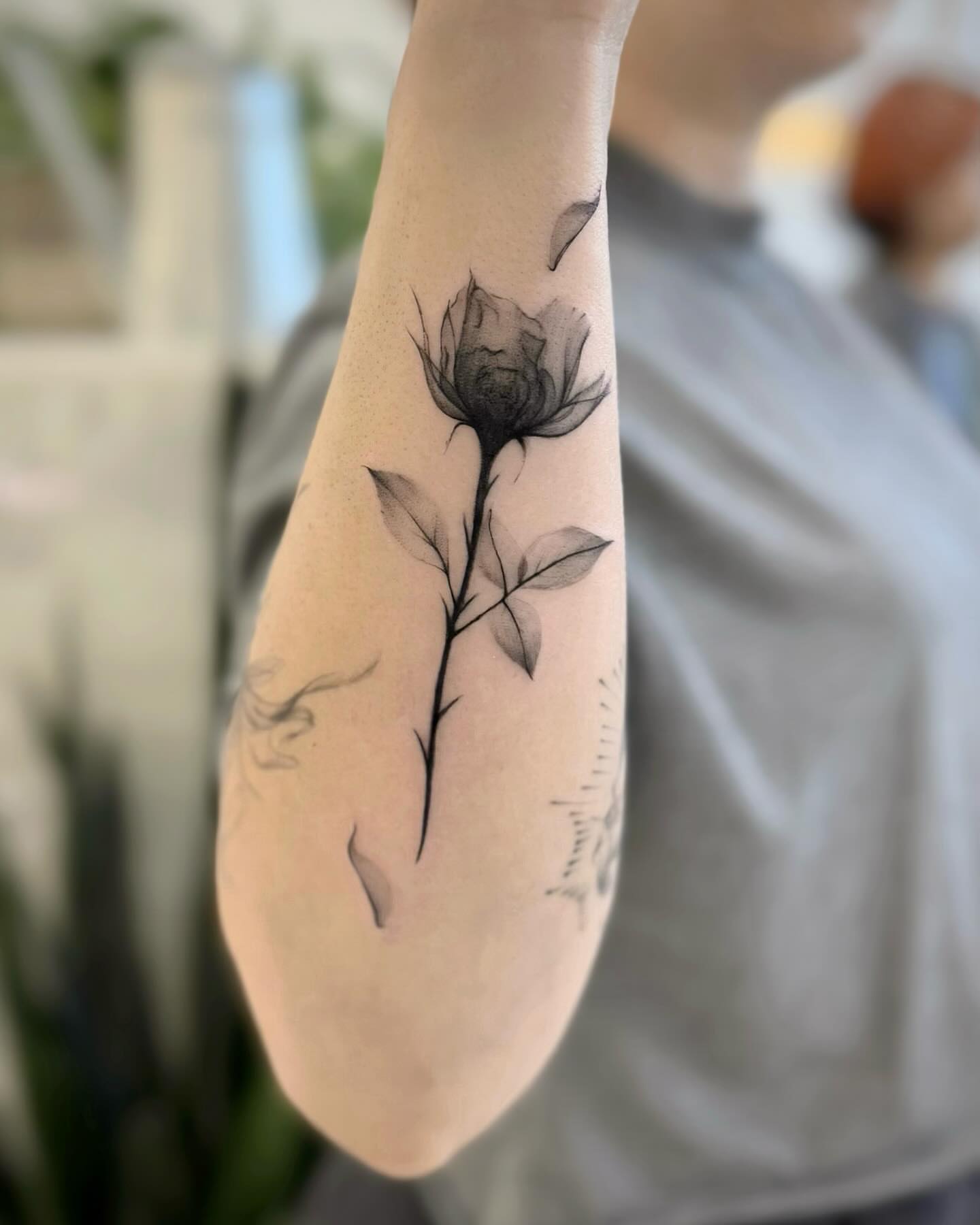 Flower black and grey tattoo on the forearm by David H.