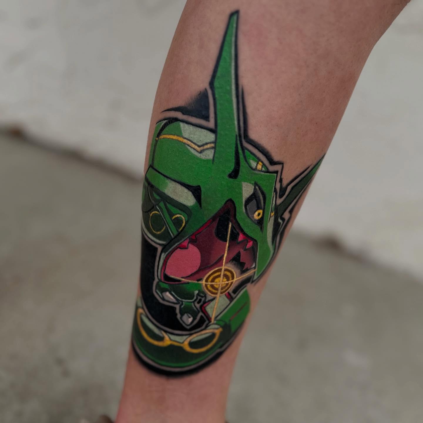 Green mask geometric tattoo on the forearm by zackery simpson