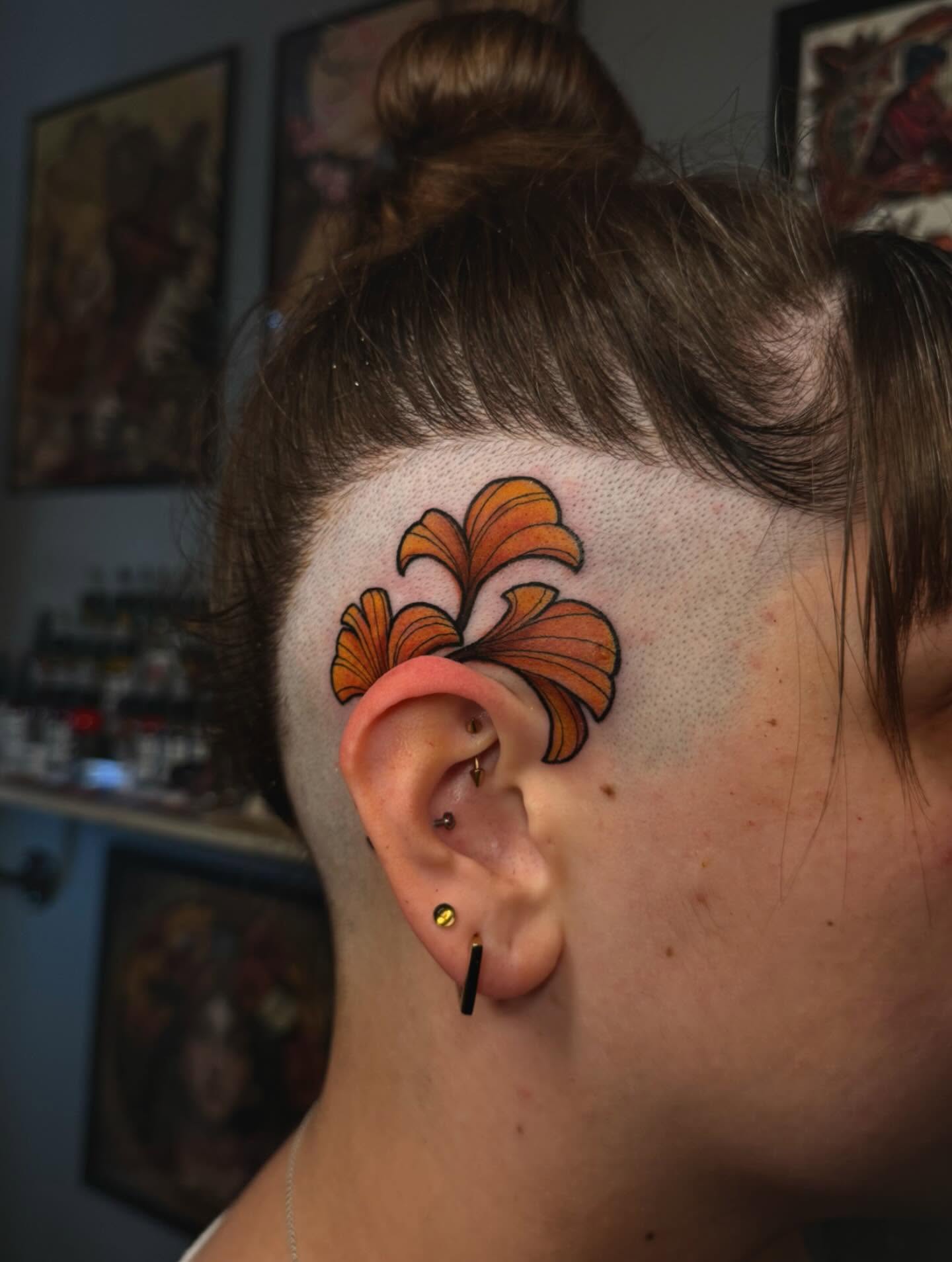 Floral design American traditional tattoo on the head by laura baldwin