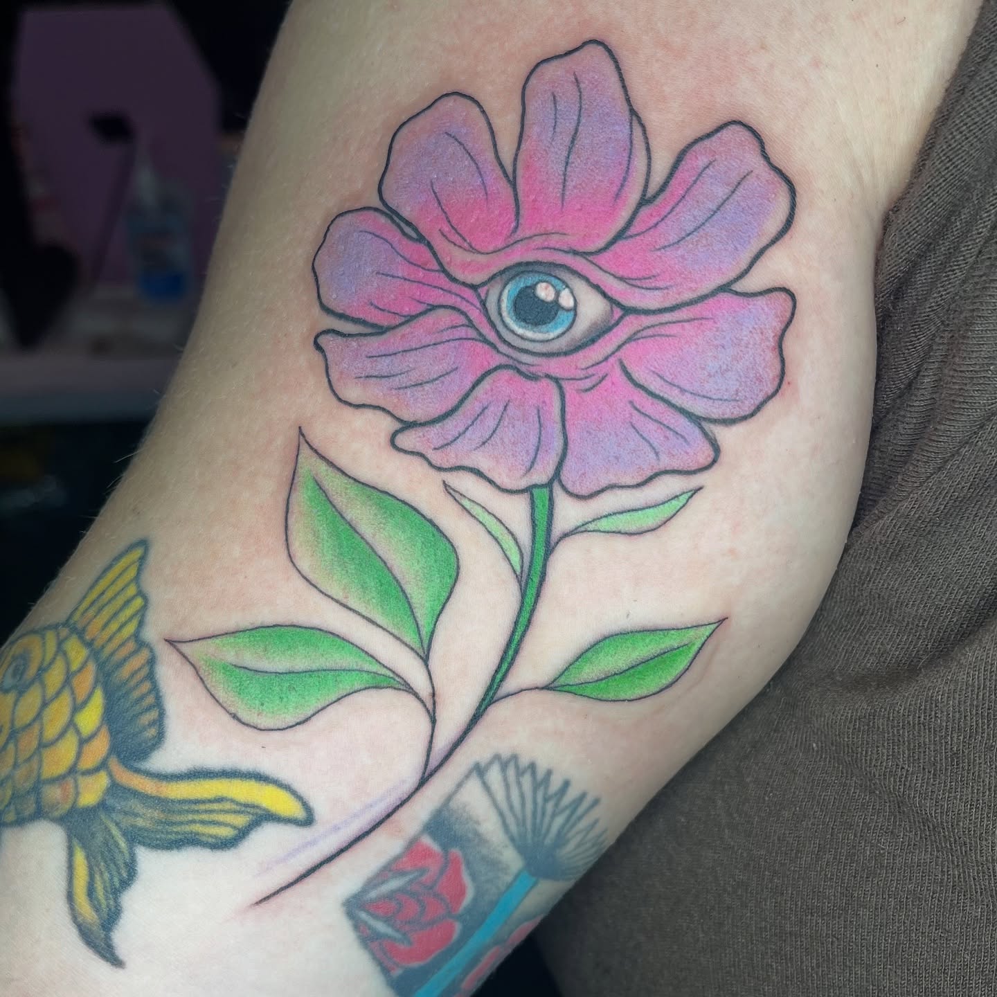 Flower with eye American traditional tattoo on the forearm by Krystal ✨