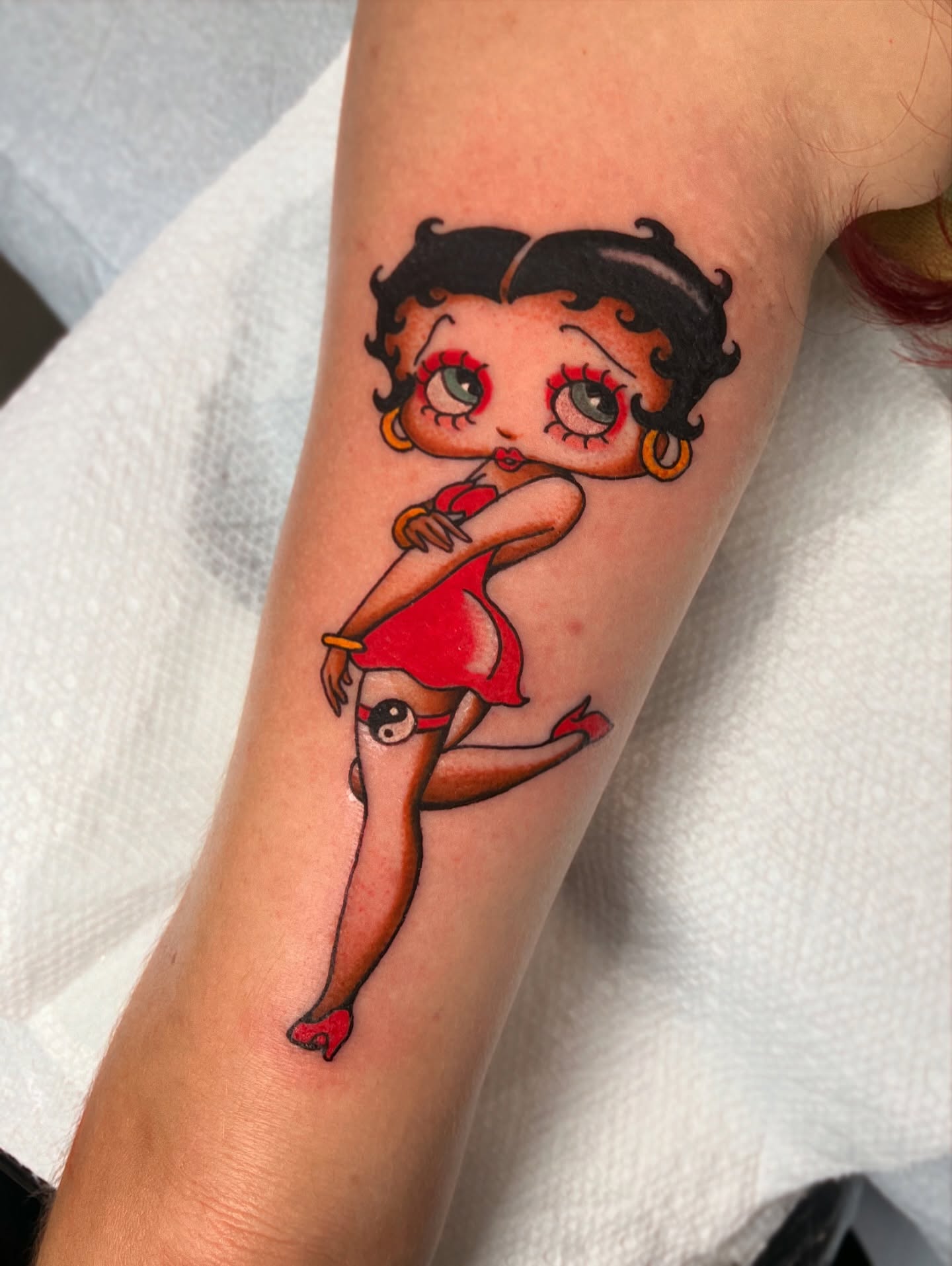 Betty Boop American traditional tattoo on the forearm by superteal