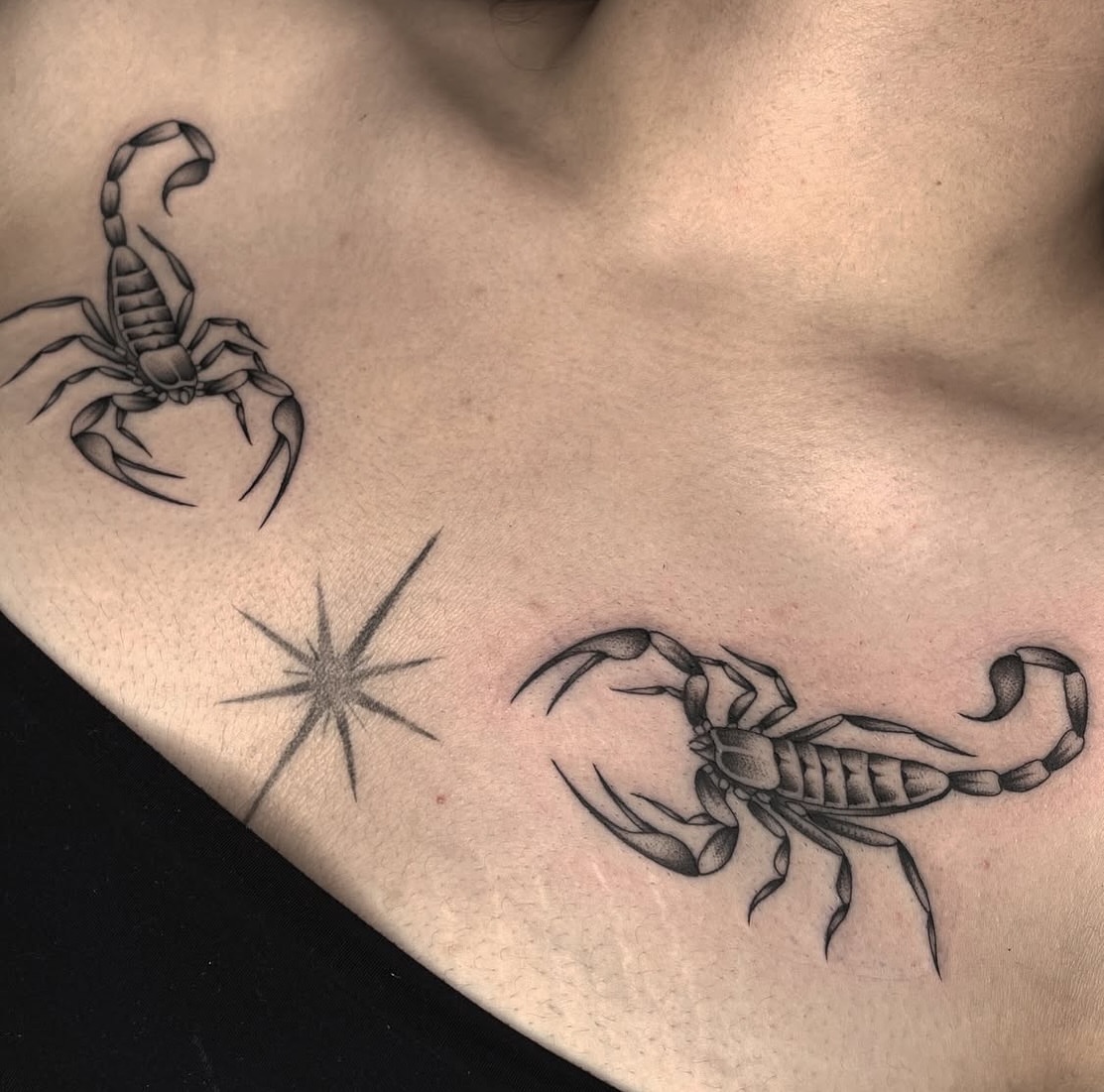 Scorpion black and grey tattoo on the chest by Dakota Jenner