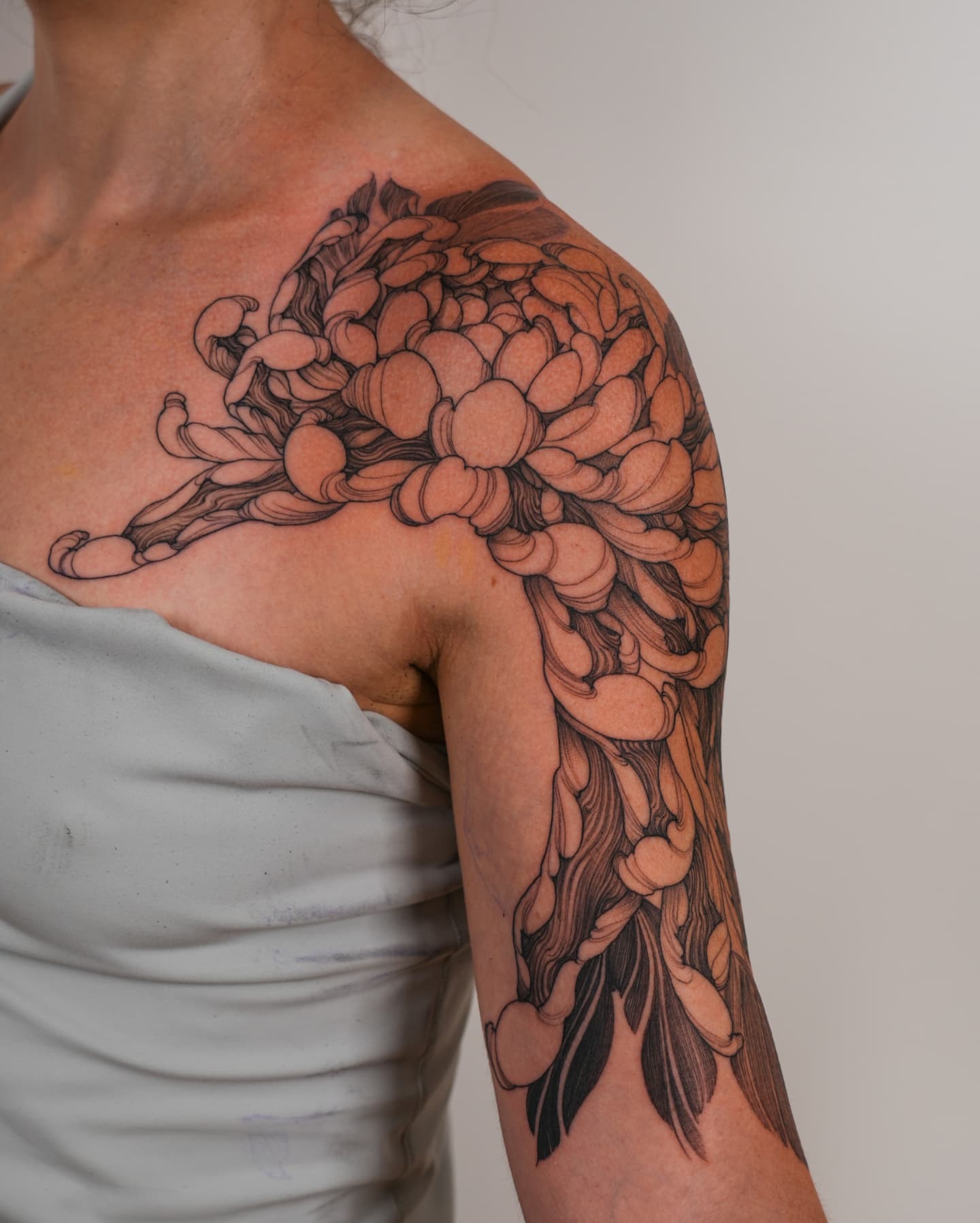 Chrysanthemum black and grey tattoo on the shoulder by ๐ฏ๐๐๐๐ ๐ท๐๐๐๐