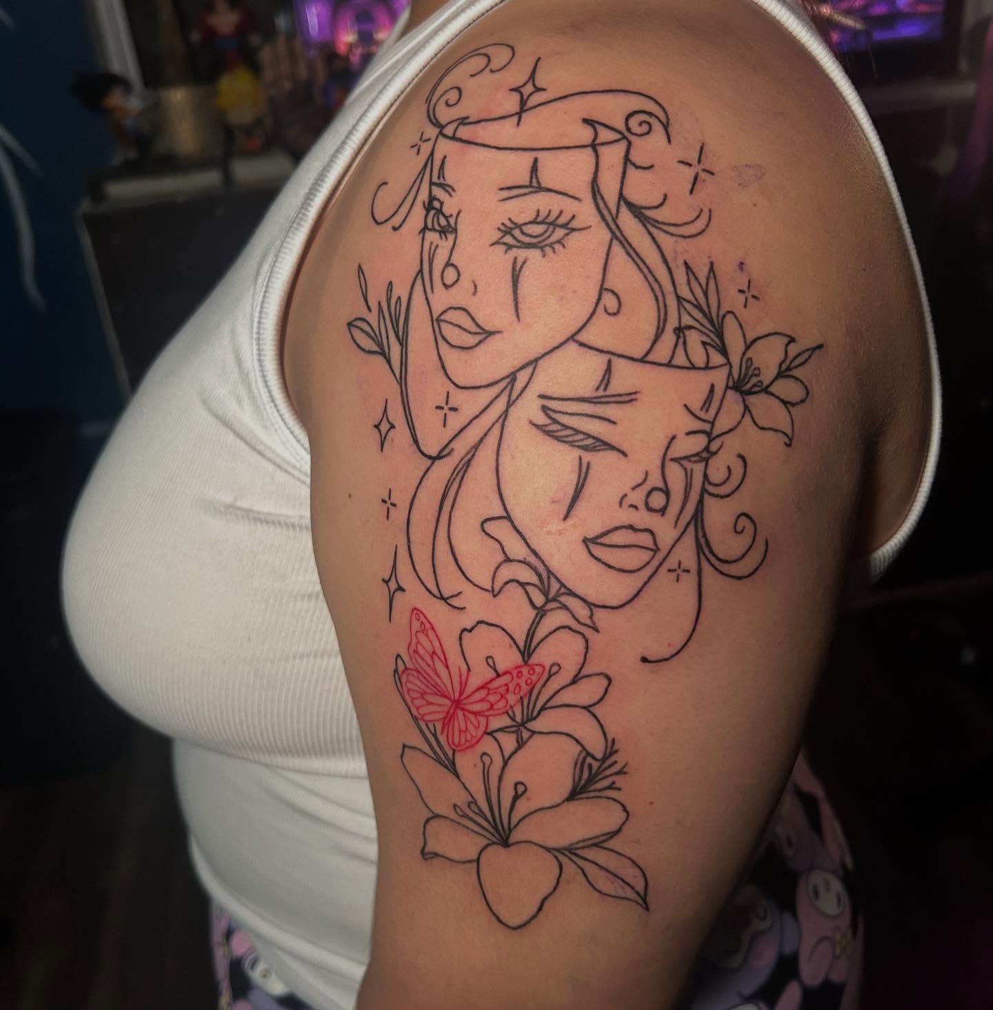 Woman's faces fine line tattoo on the shoulder by Kells