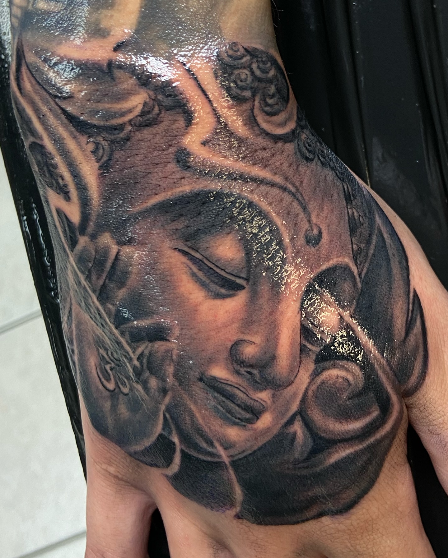 Buddha realism tattoo on the shoulder by Chicago Tattoo Artist