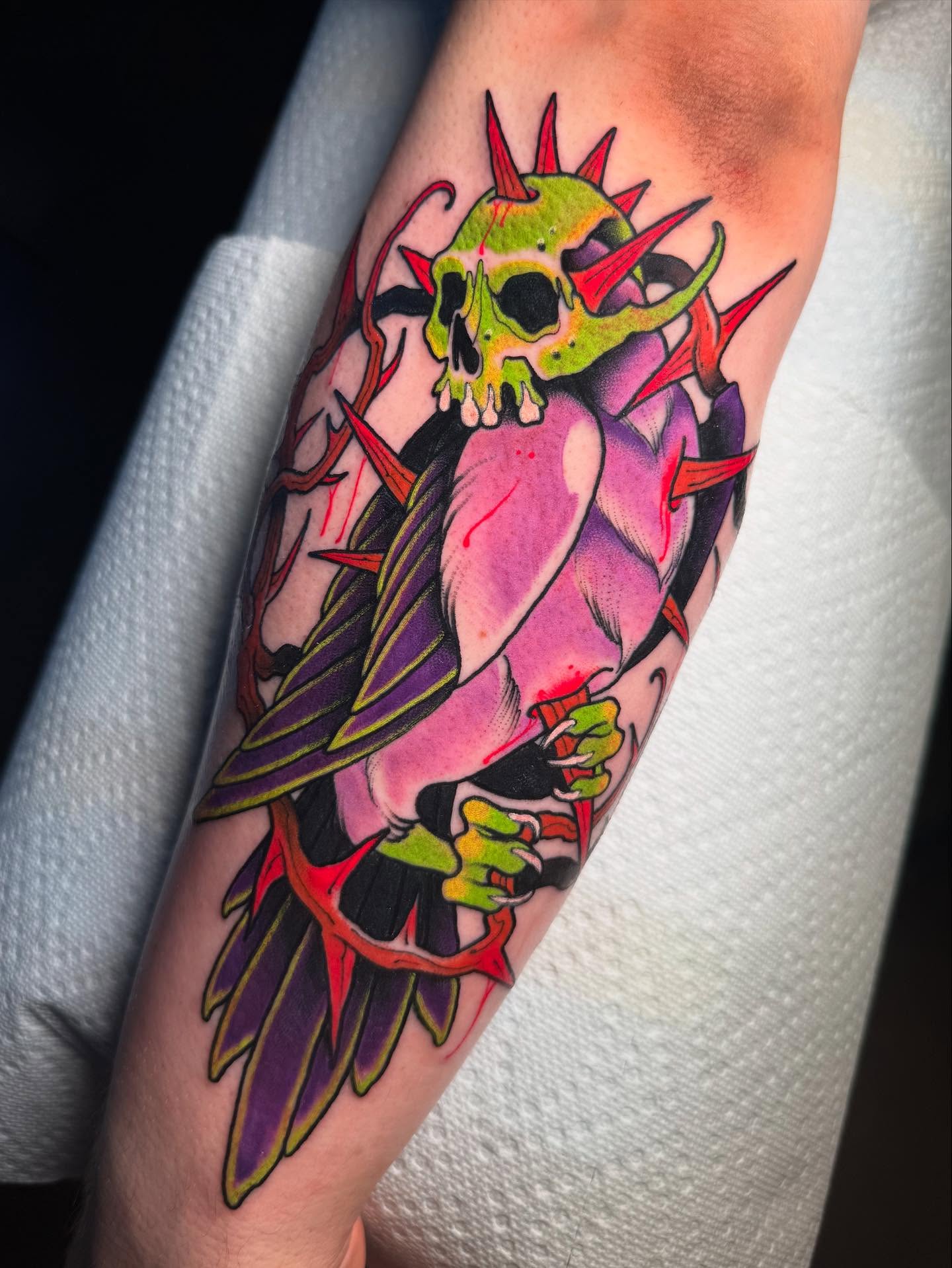 Skull with wings American traditional tattoo on the forearm by Jess Longfield, Des Moines, Iowa
