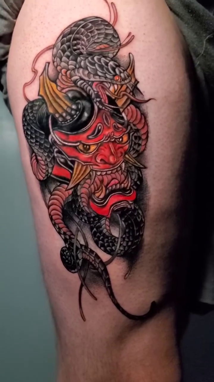 Hannya mask with snake Japanese tattoo on the thigh by William Gualteros