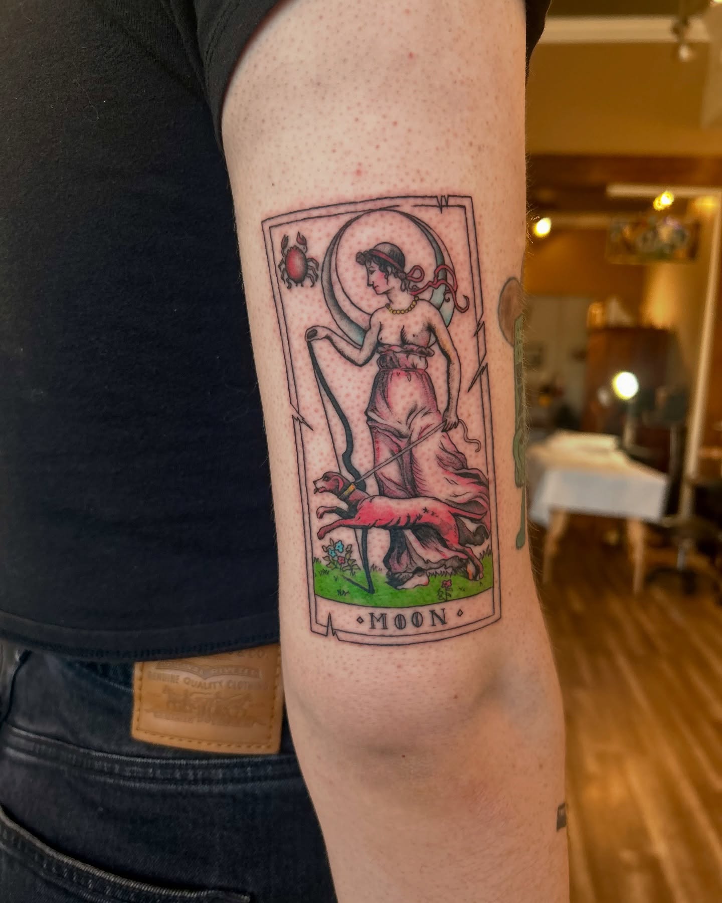 Moon tarot card illustrative tattoo on the forearm by King By Trade 👑