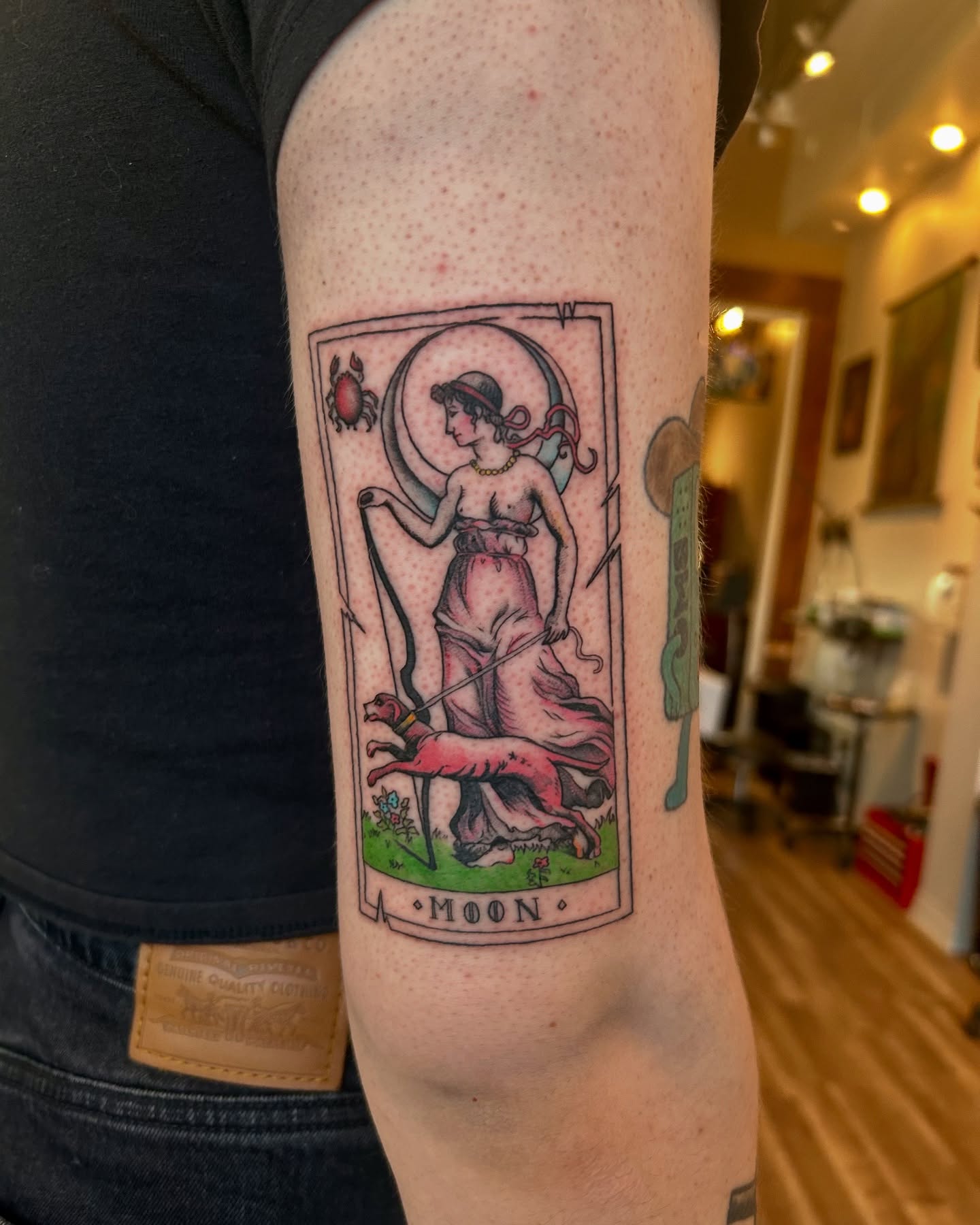 Moon tarot card illustrative tattoo on the forearm by King By Trade 👑
