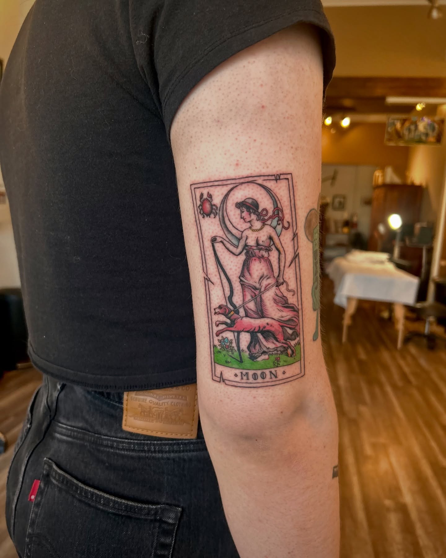 Moon tarot card illustrative tattoo on the forearm by King By Trade 👑