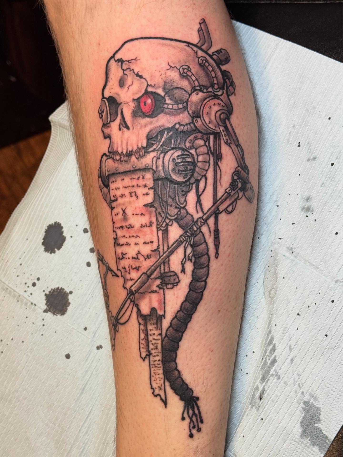 Cyborg skull dark realism tattoo on the forearm by Kyle J. Bishop