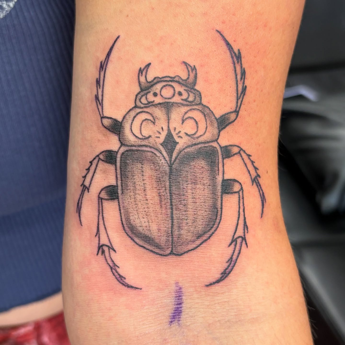 Scarab beetle black and grey tattoo on the forearm by Tori Anderson, Minneapolis, Minnesota